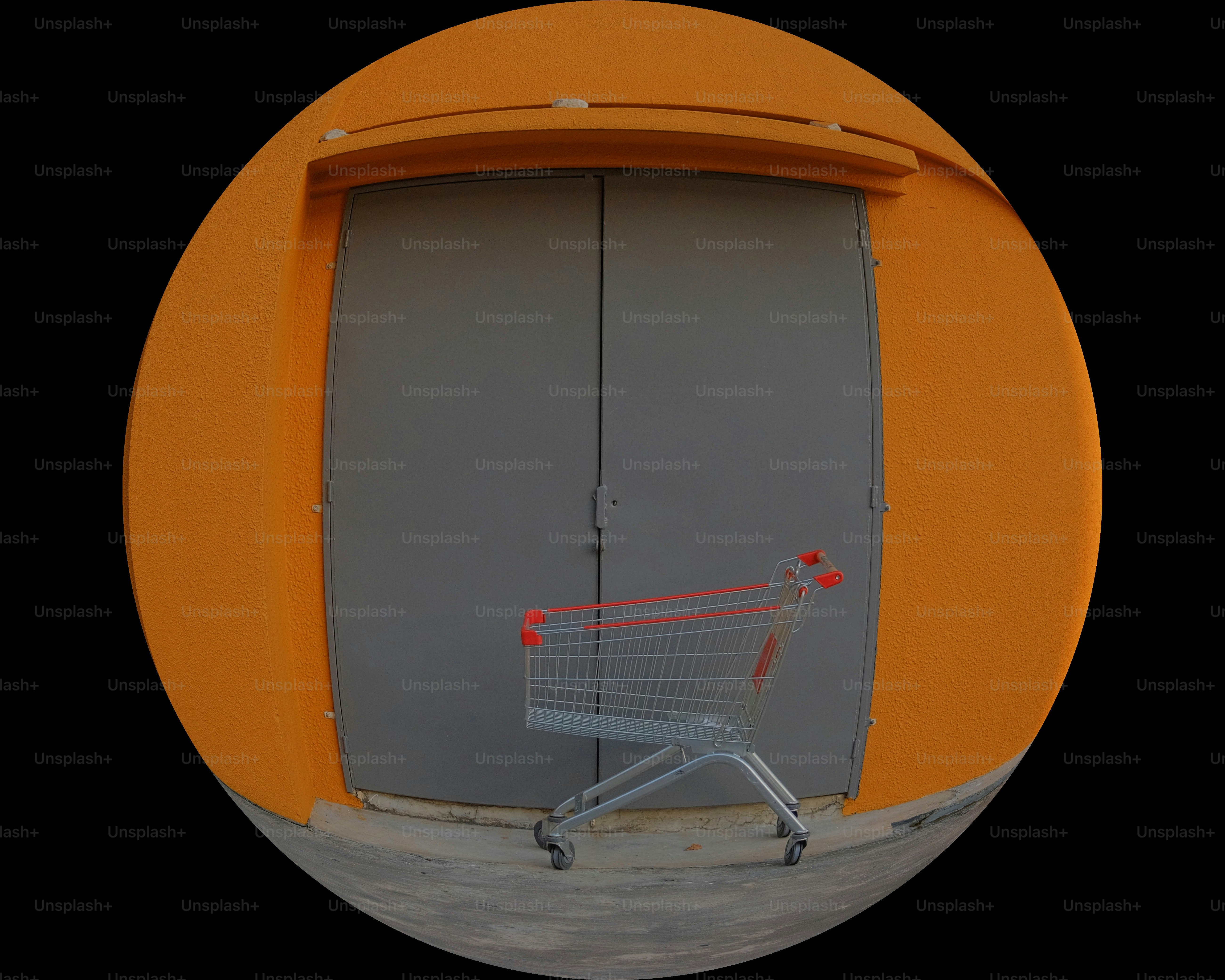A shopping cart sitting in front of a gray door