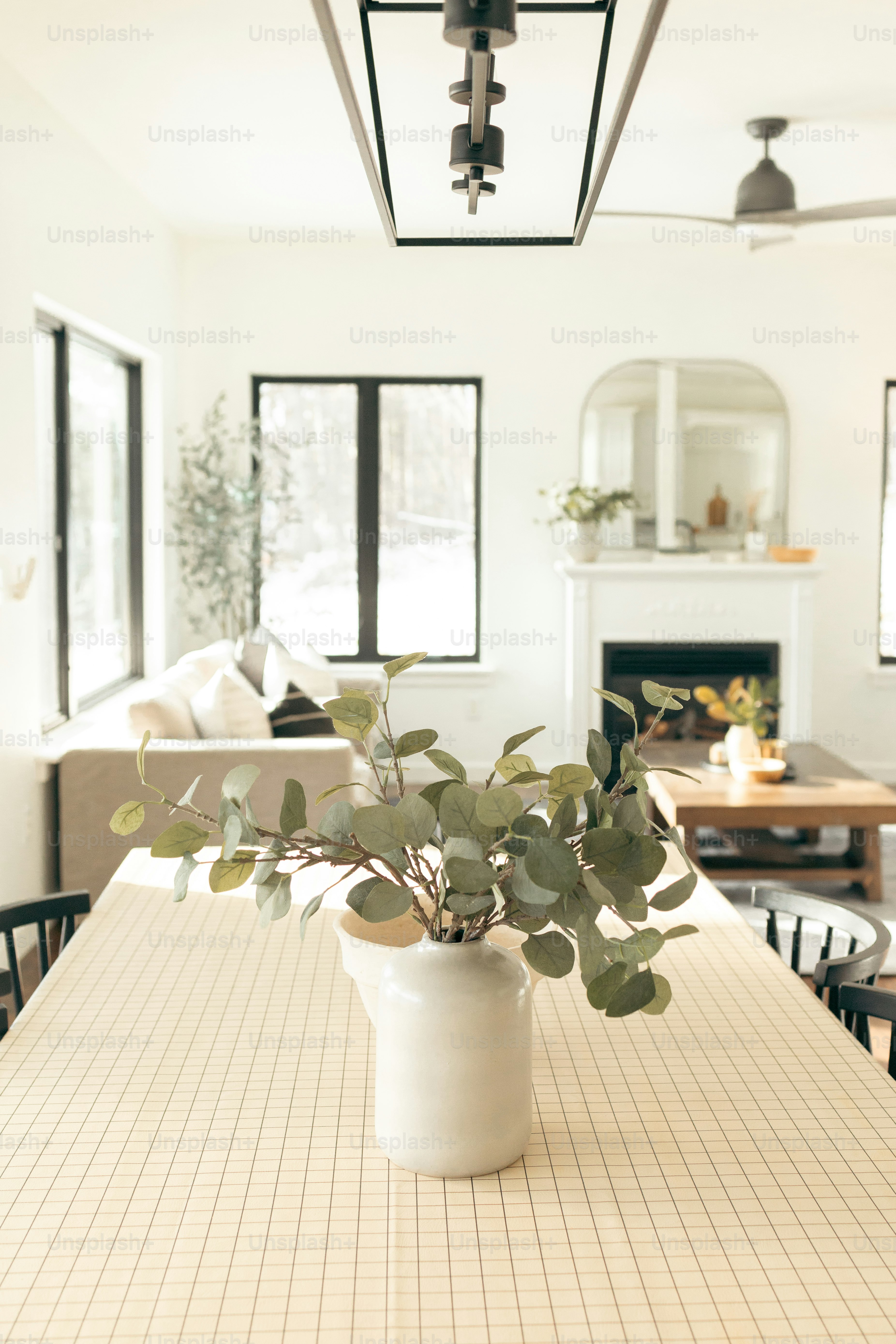 A dining room table with a vase of flowers on it photo – House Image on ...