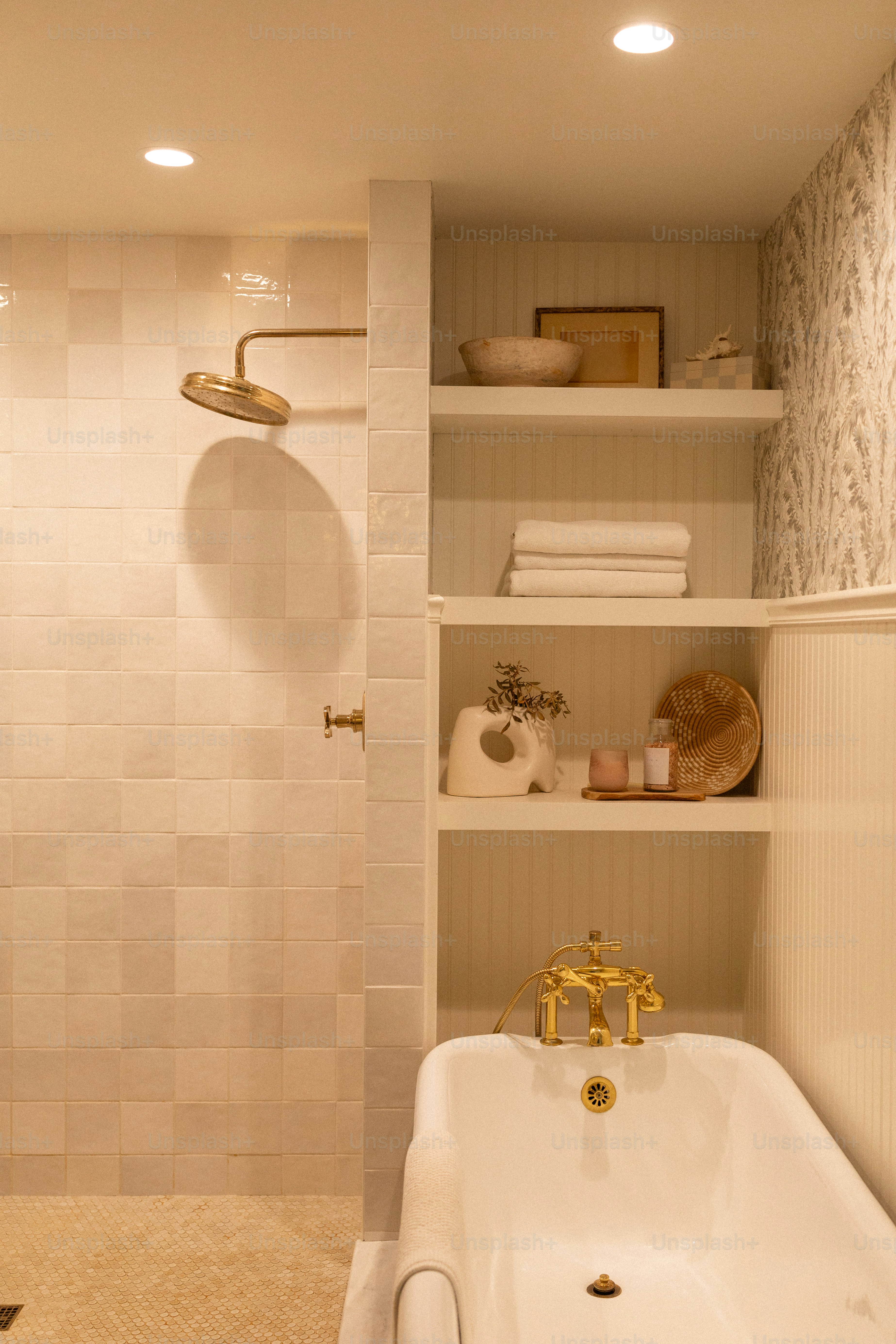 A white bath tub sitting next to a walk in shower
