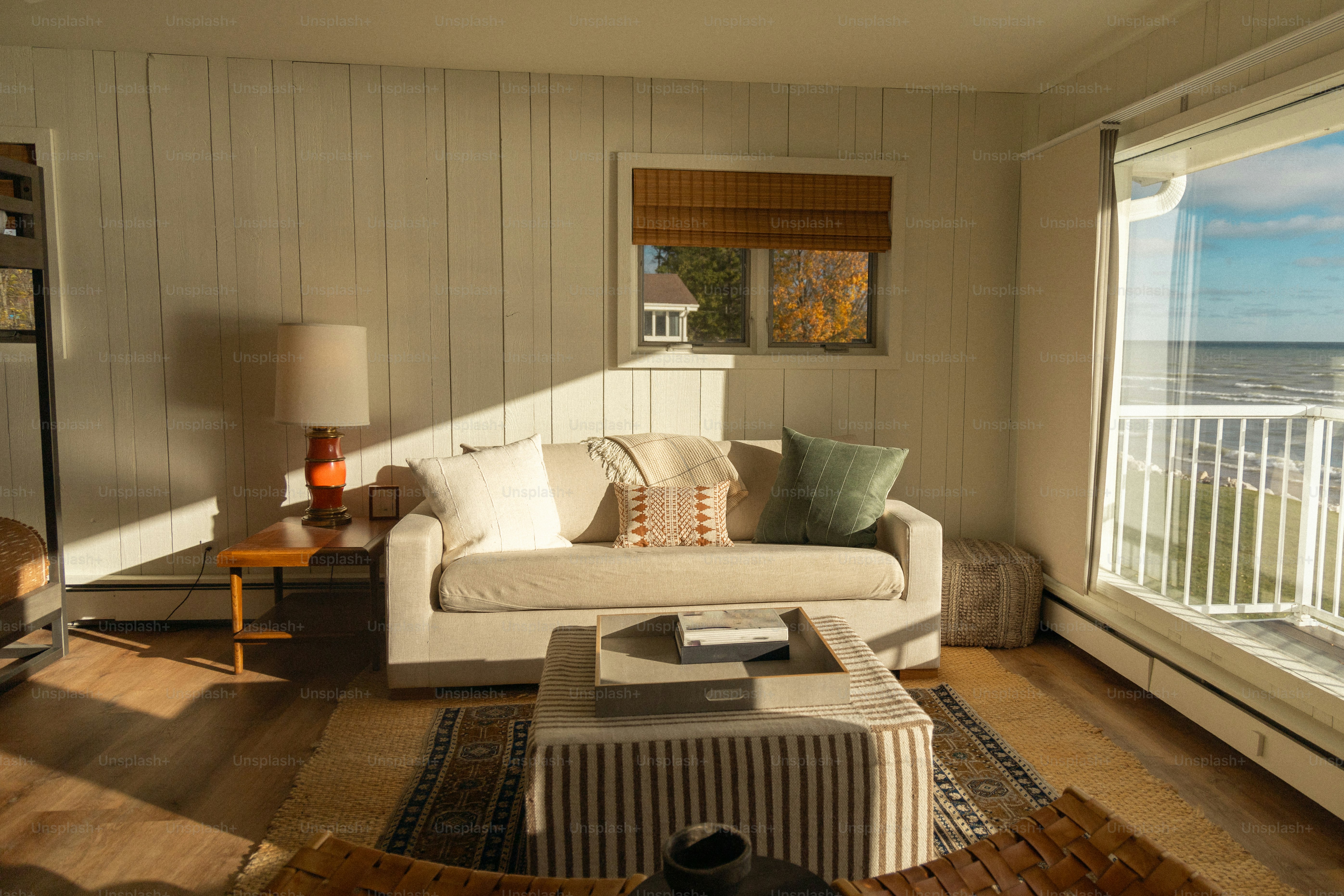 A living room filled with furniture and a large window