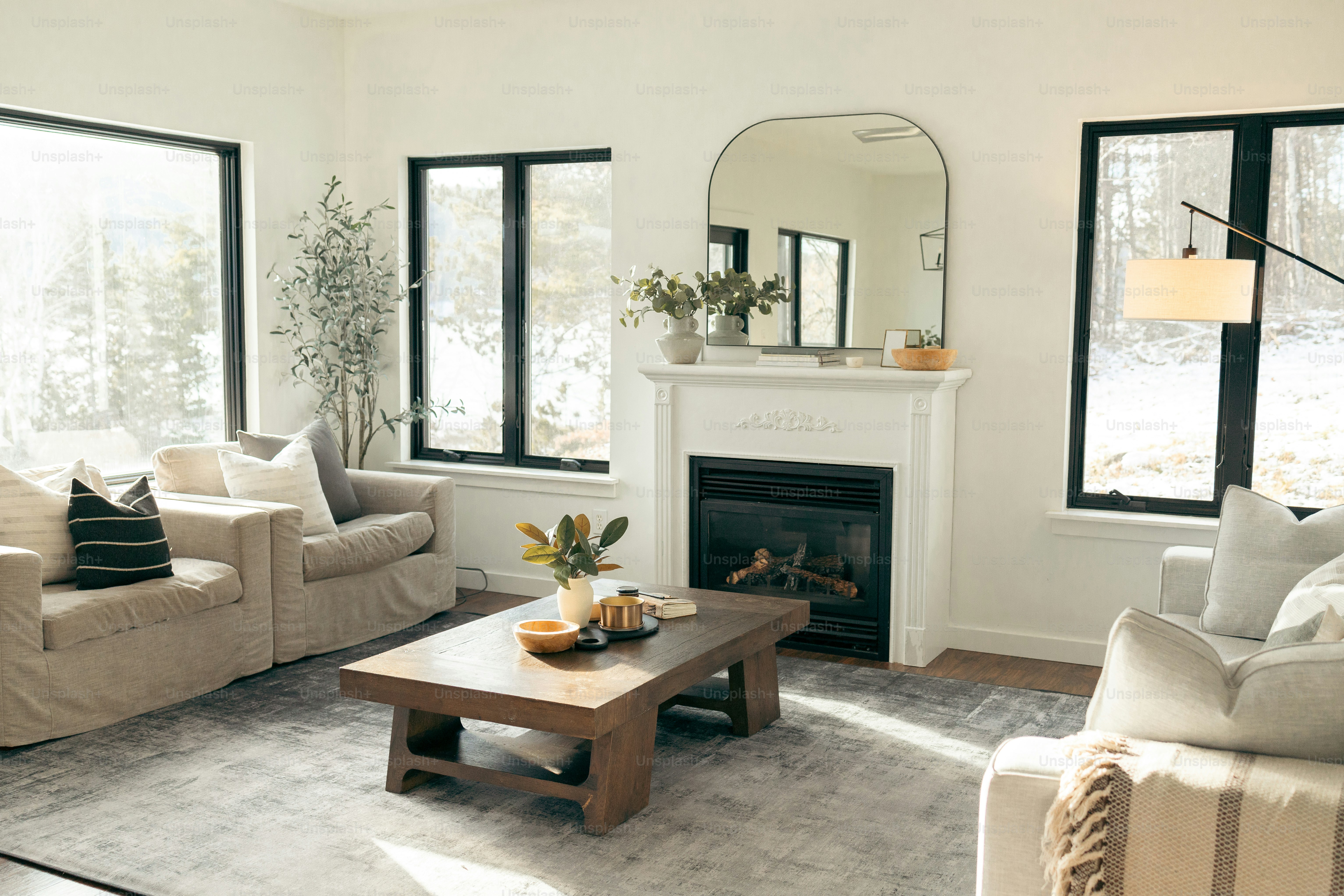 A living room filled with furniture and a fire place