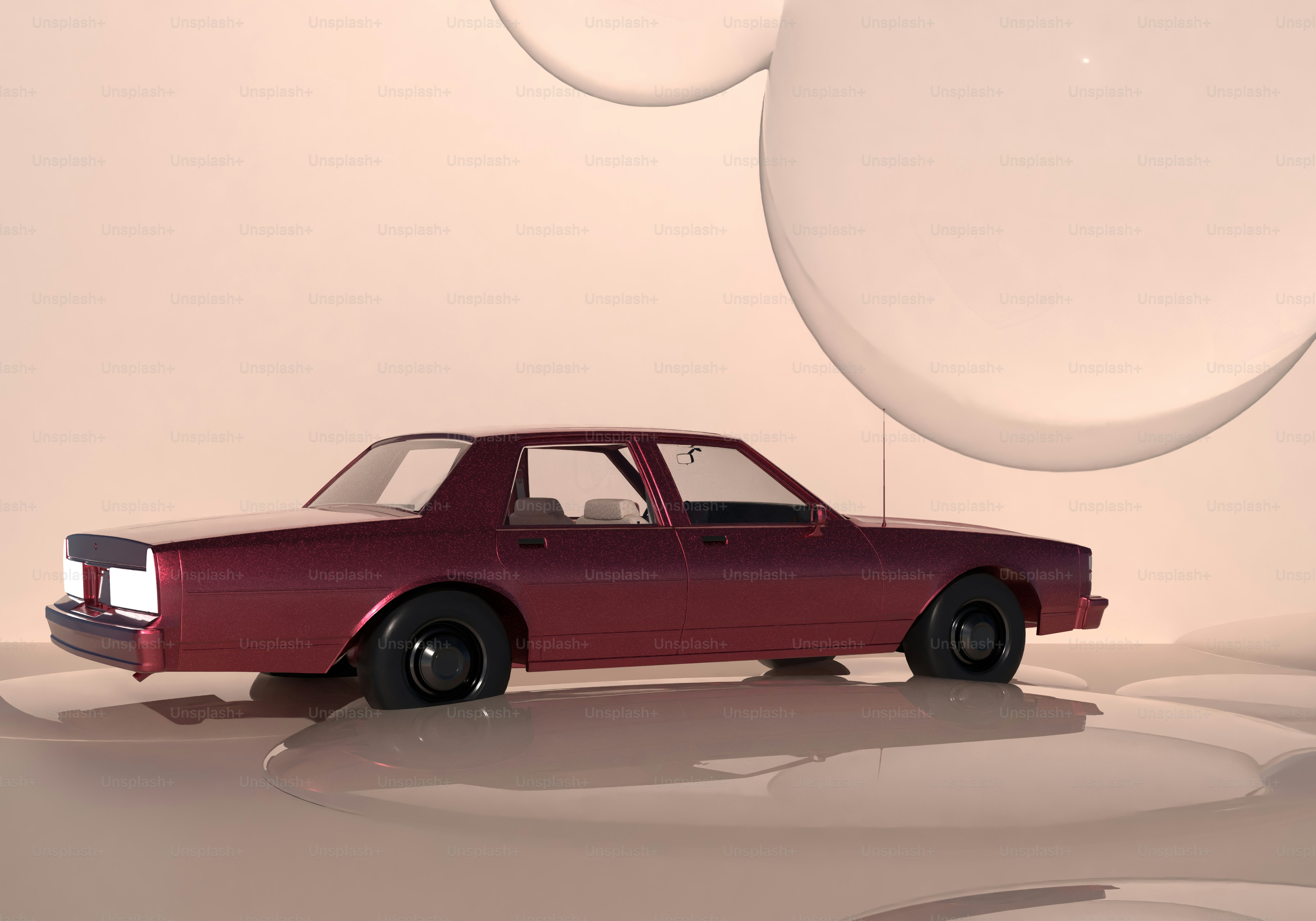 A red car parked in front of bubbles