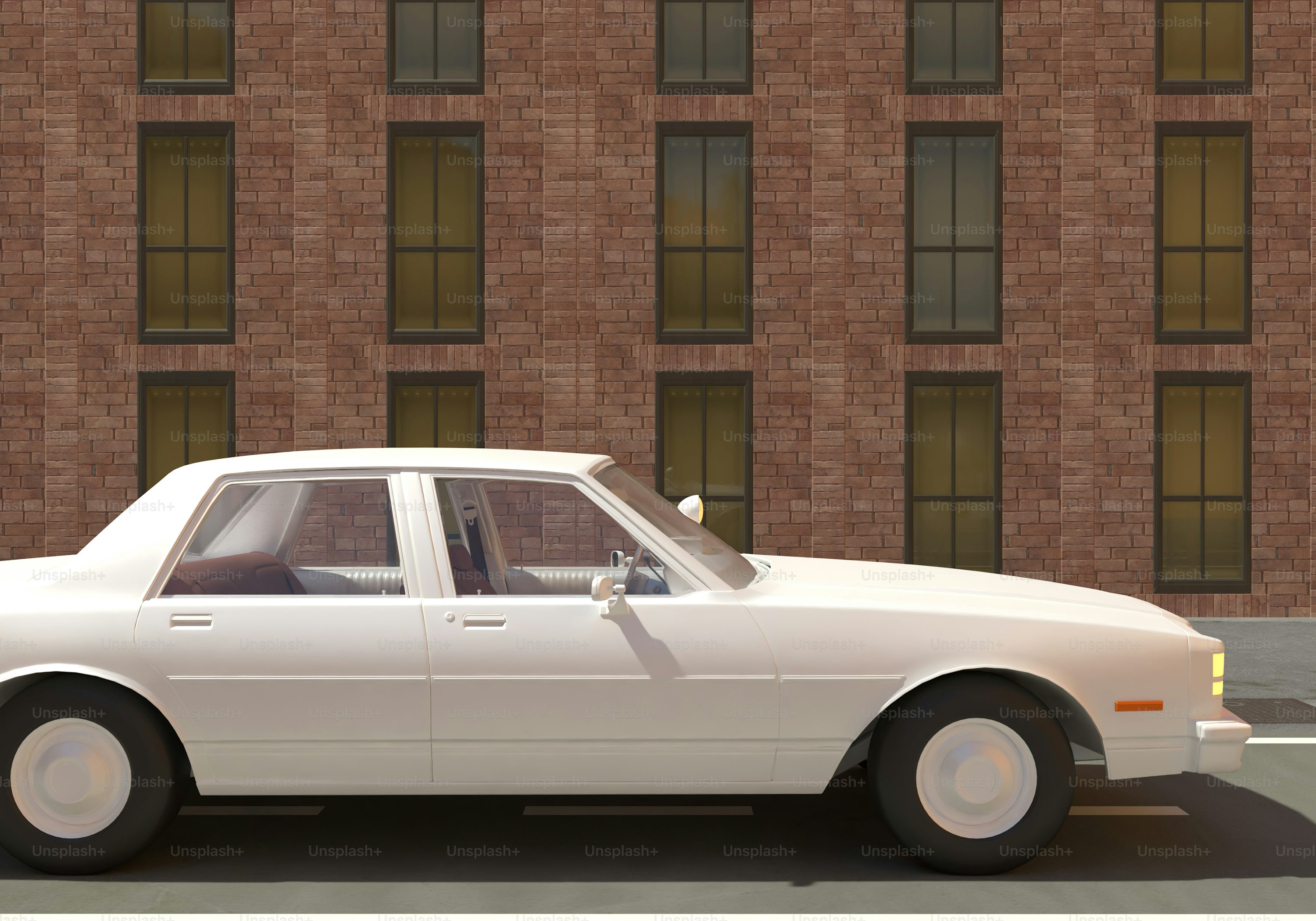A white car parked in front of a tall building