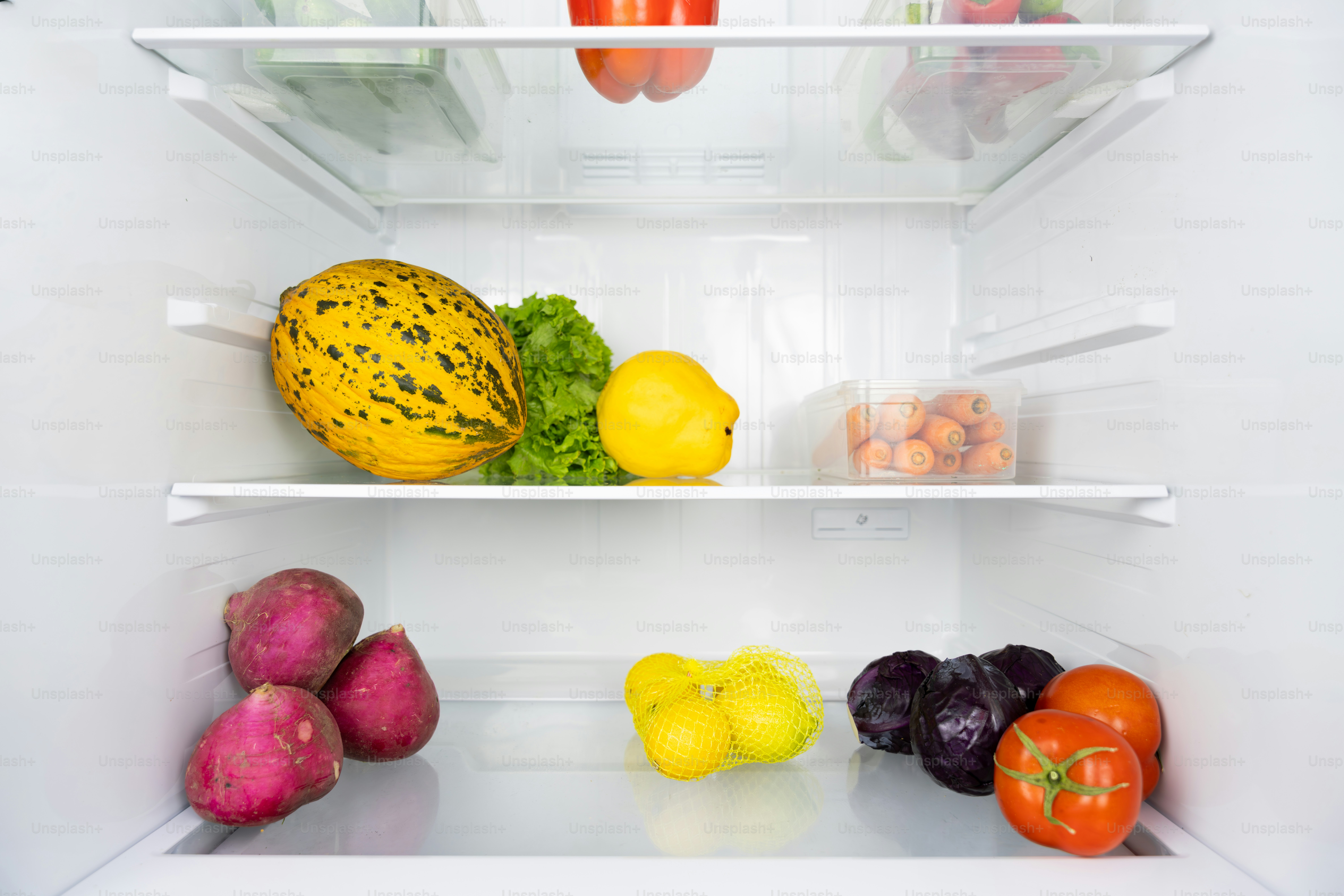 A refrigerator filled with lots of different types of fruits and vegetables