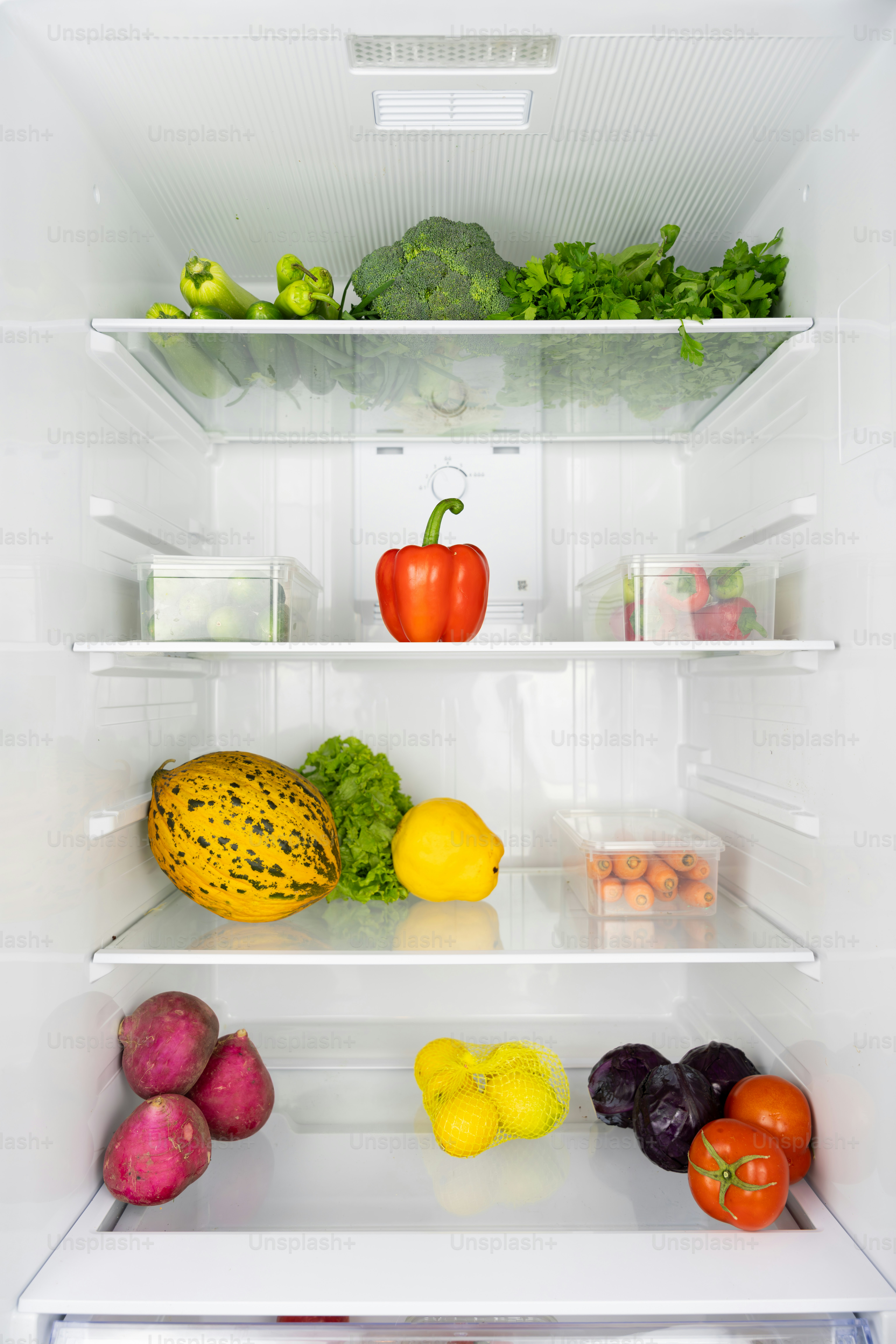 A refrigerator filled with lots of different fruits and vegetables