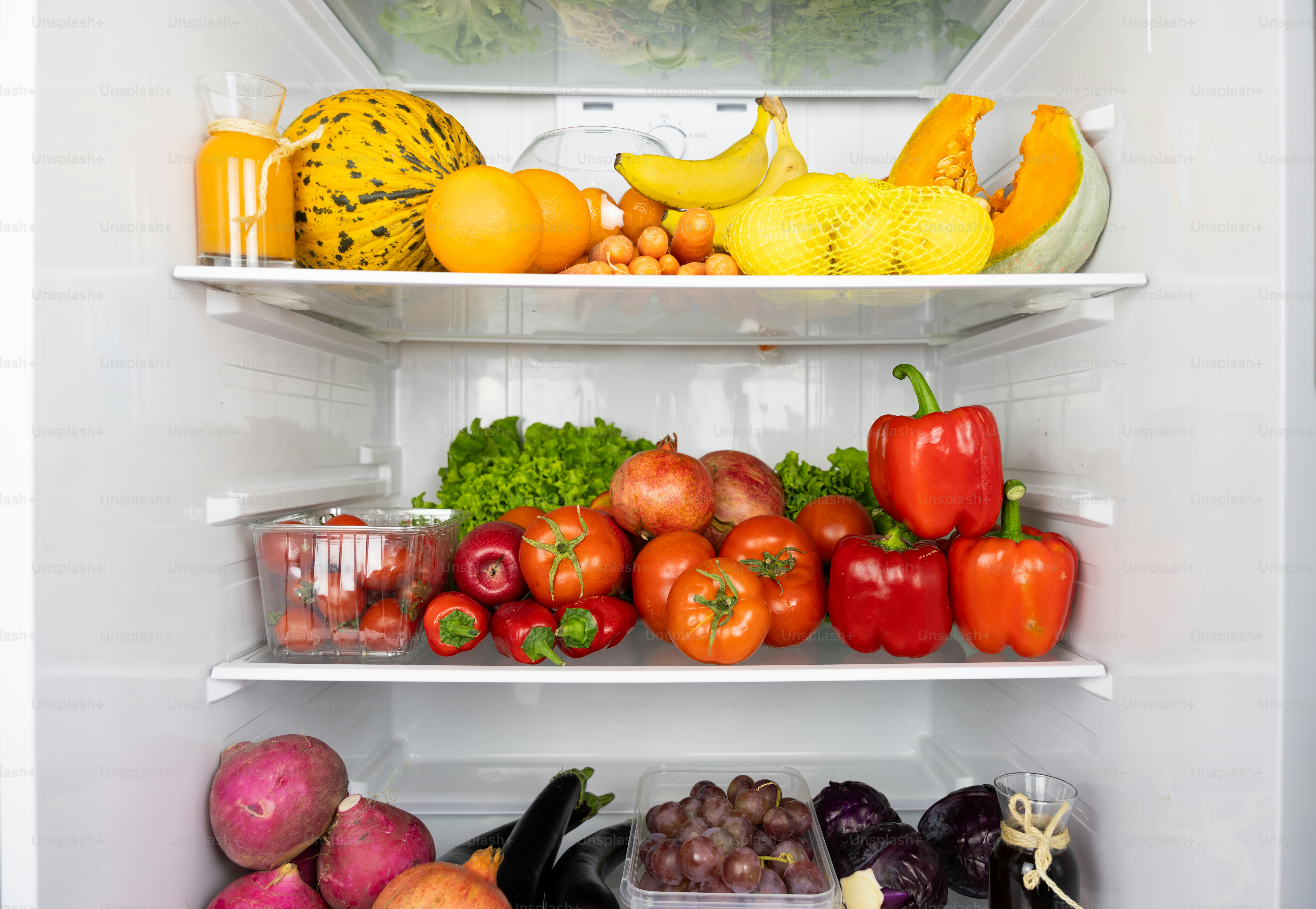 A refrigerator filled with lots of different types of fruits and vegetables