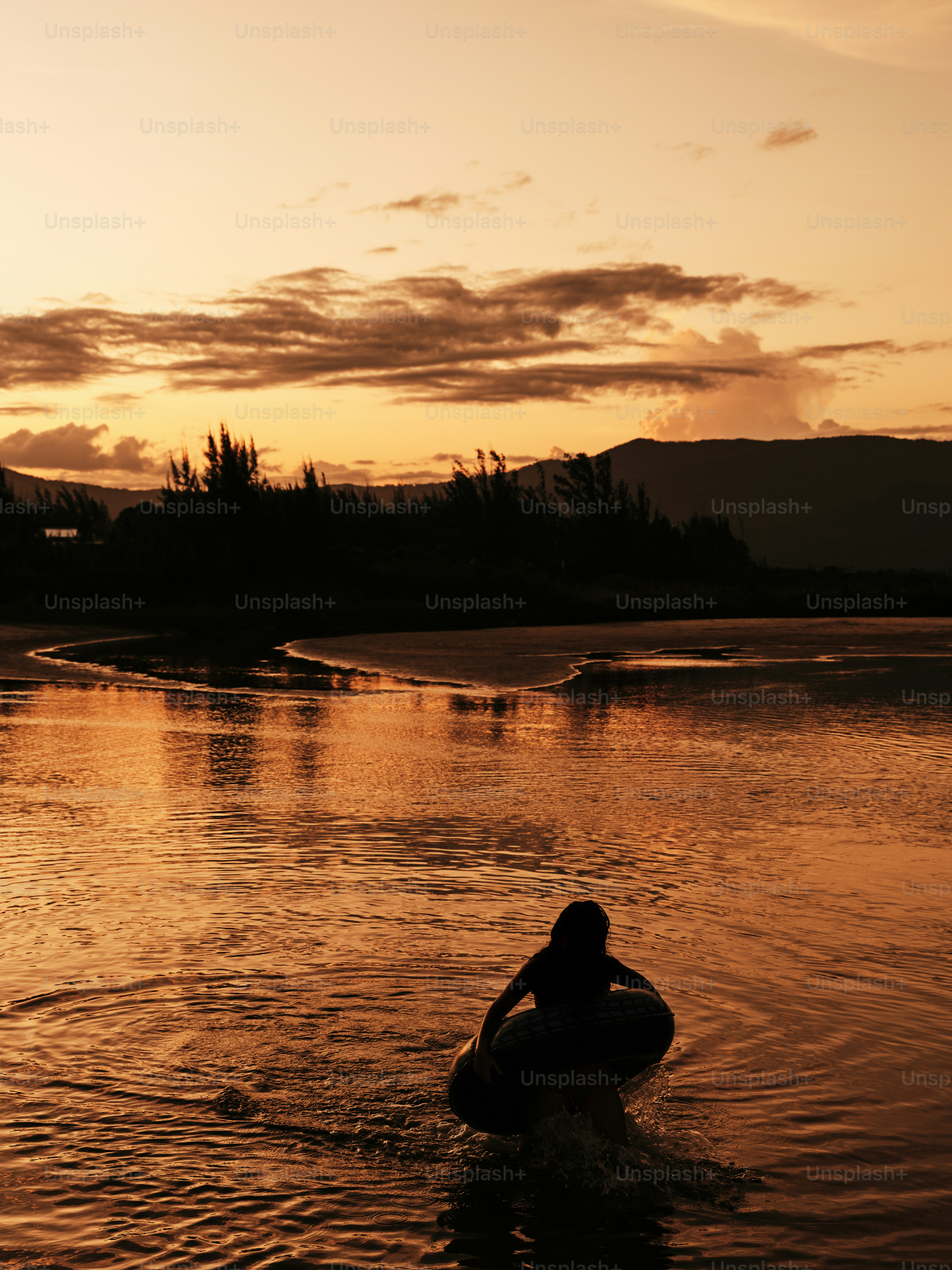 A person riding a surfboard in a body of water