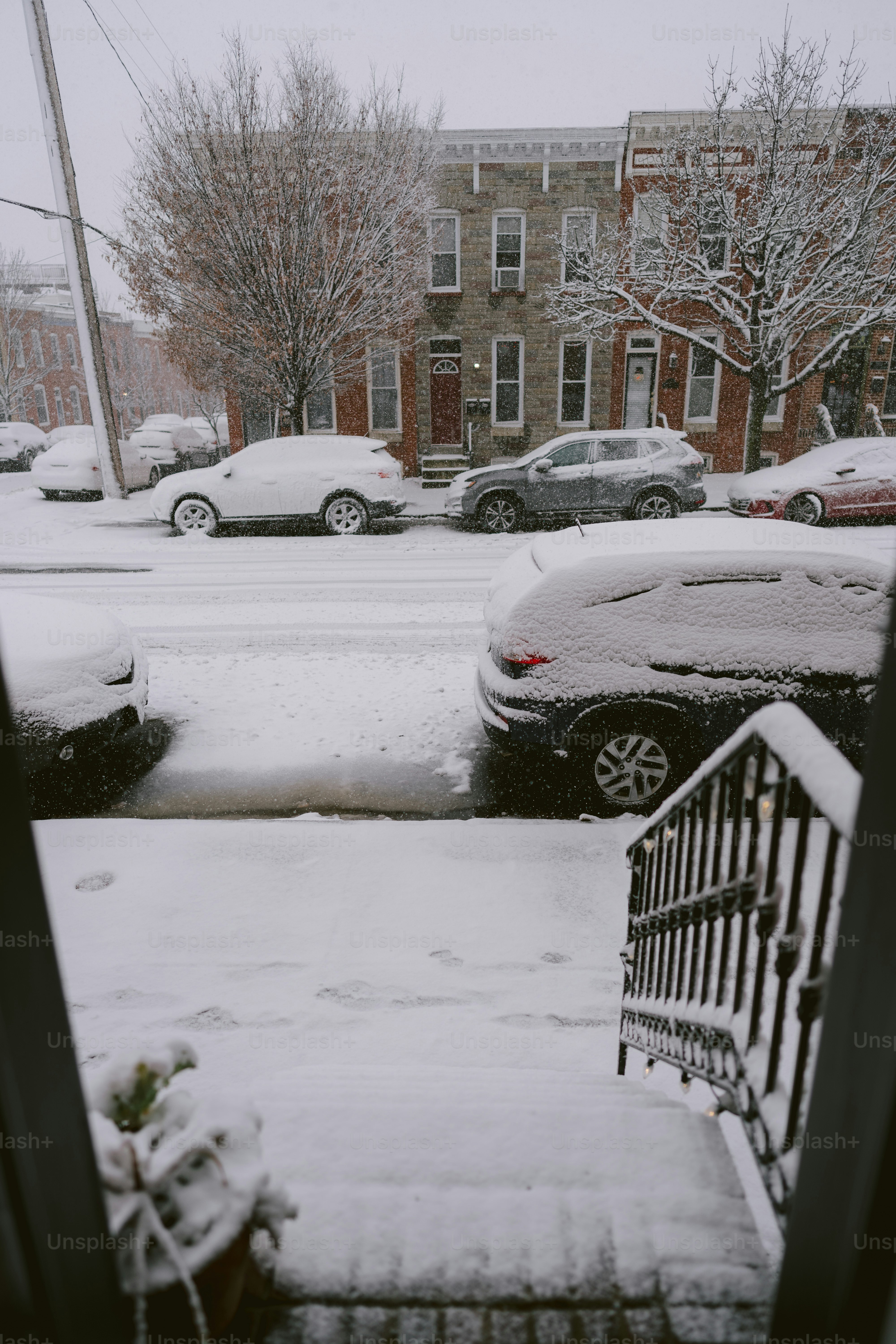 A view of a snowy street from a window