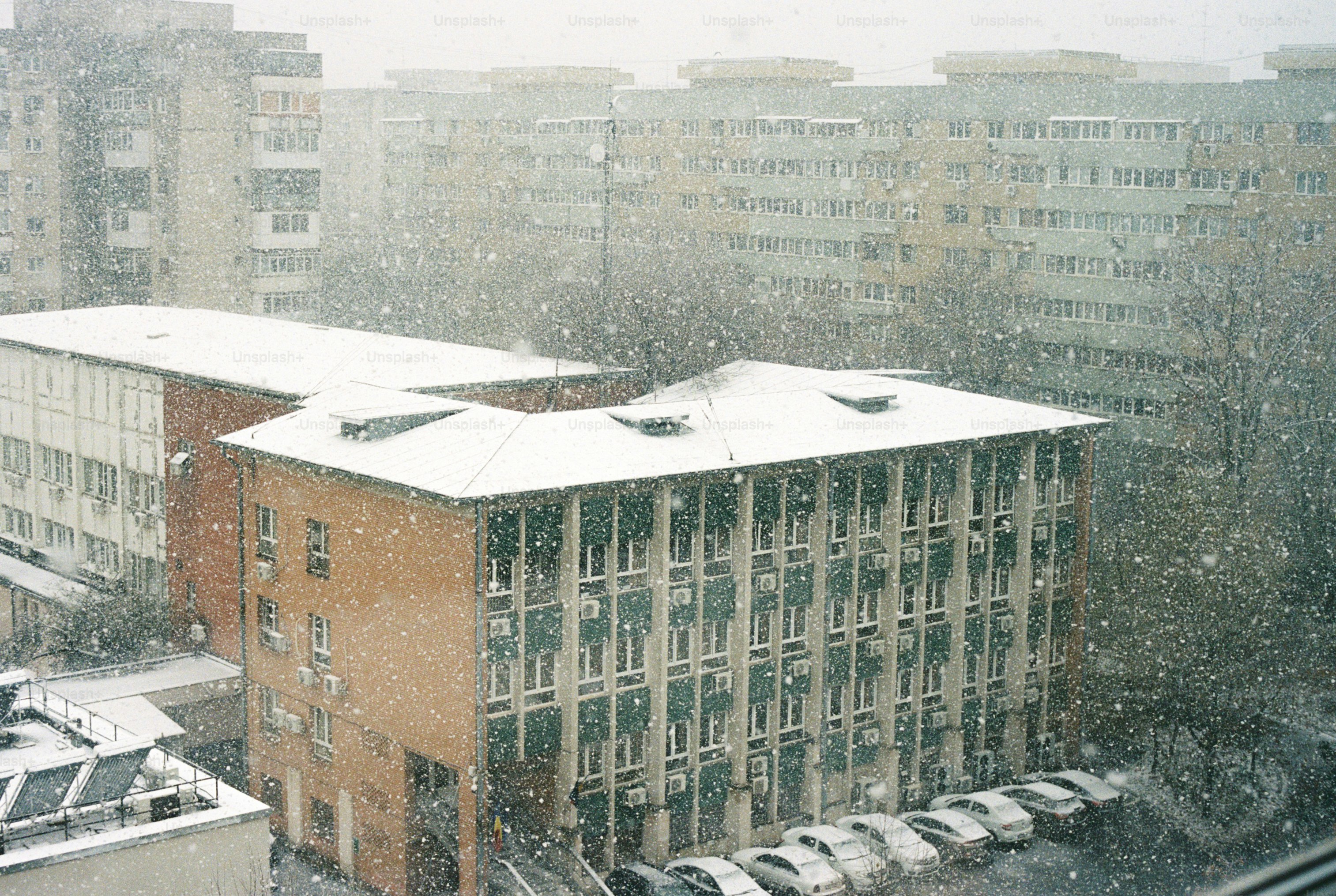 A snowy view of a city with tall buildings