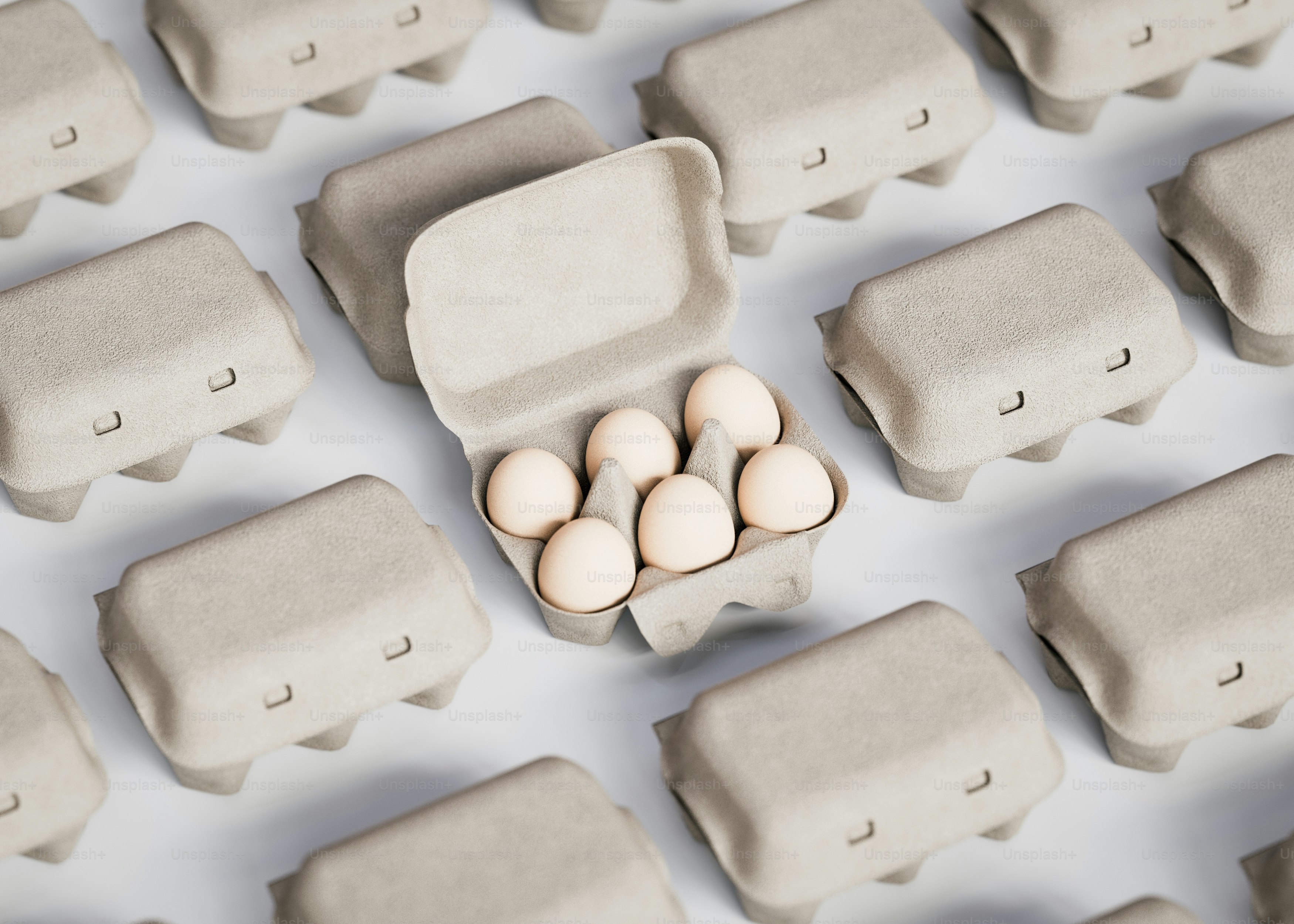A group of eggs sitting in a carton on top of a table
