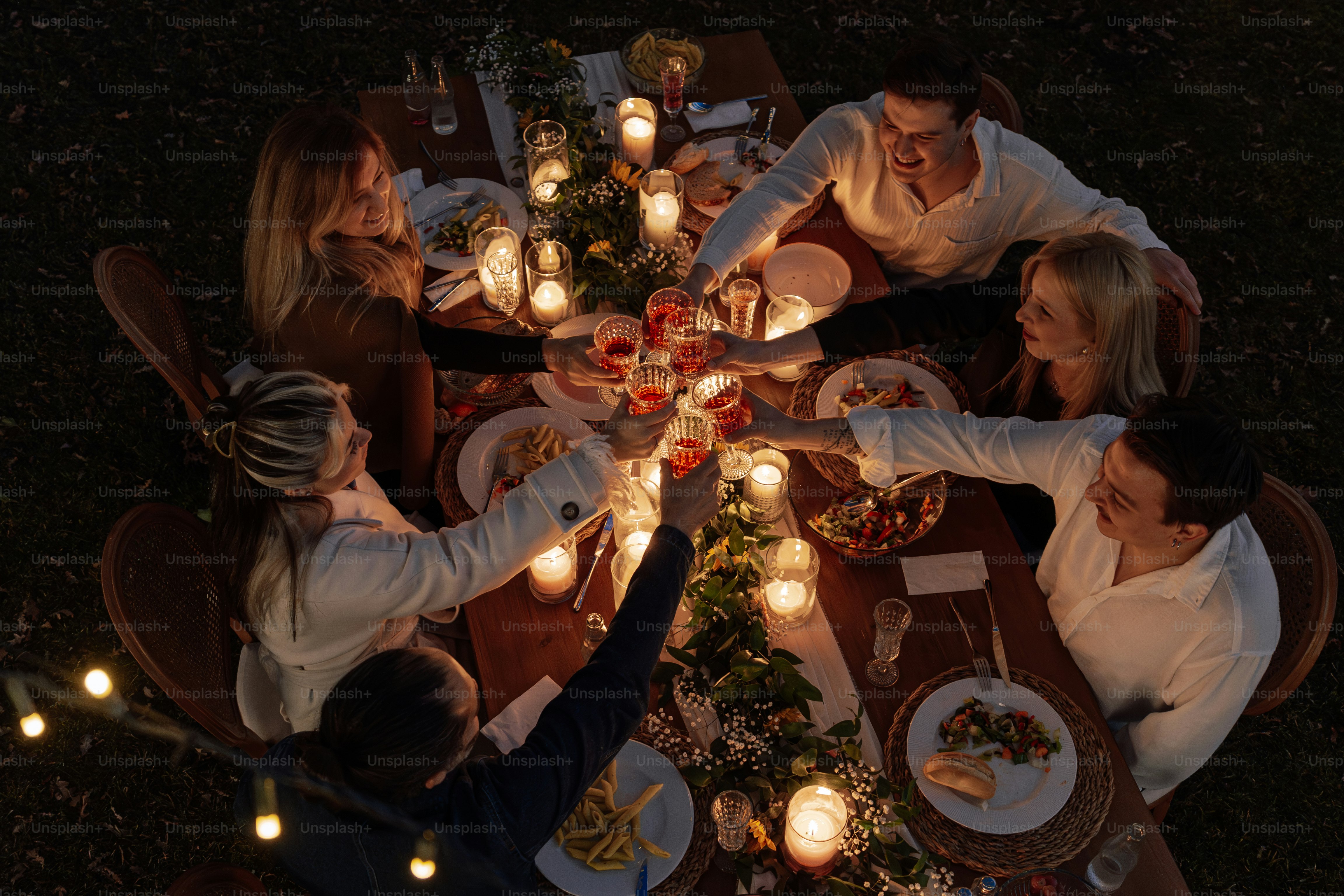 A group of people sitting around a dinner table