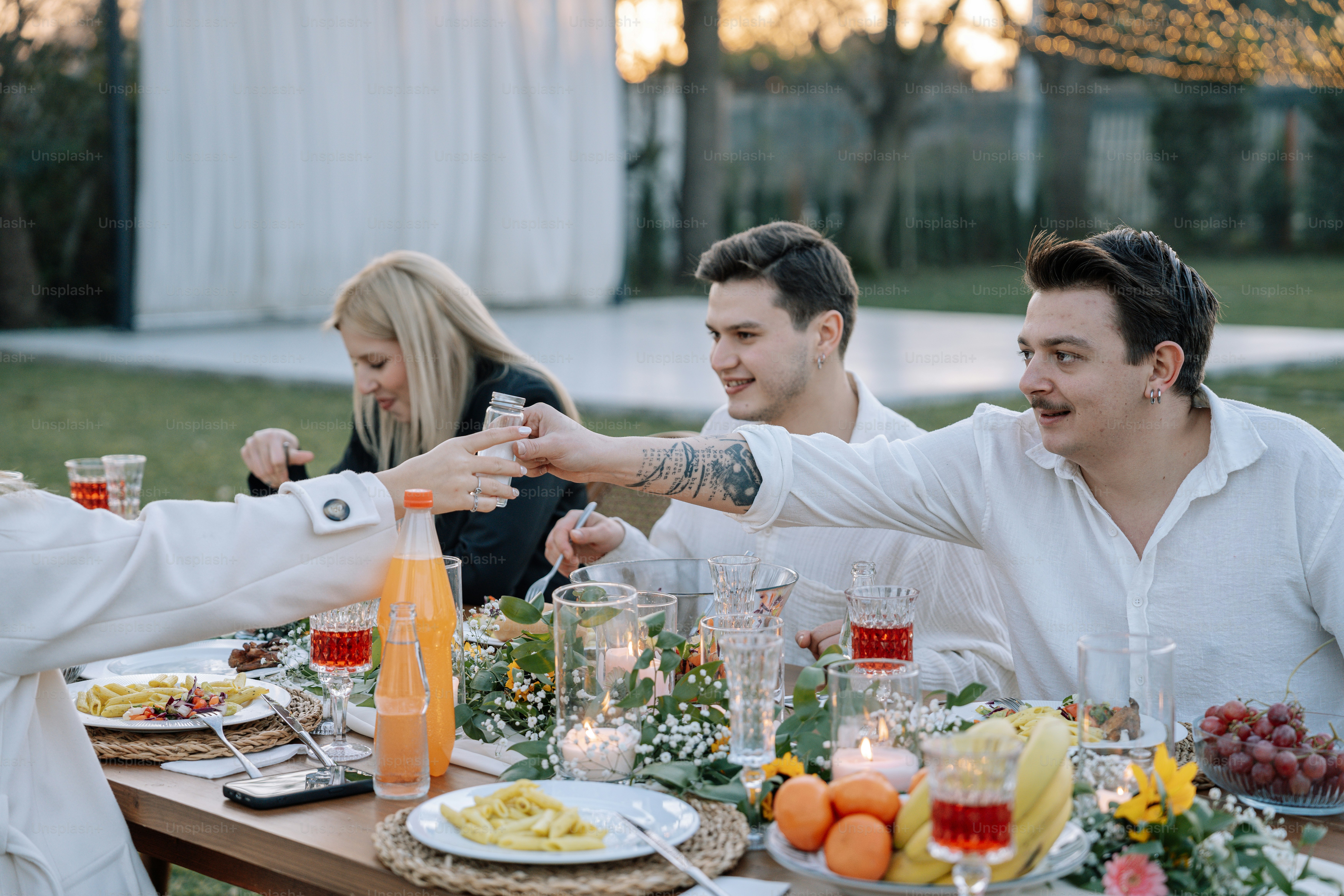 A group of people sitting around a wooden table