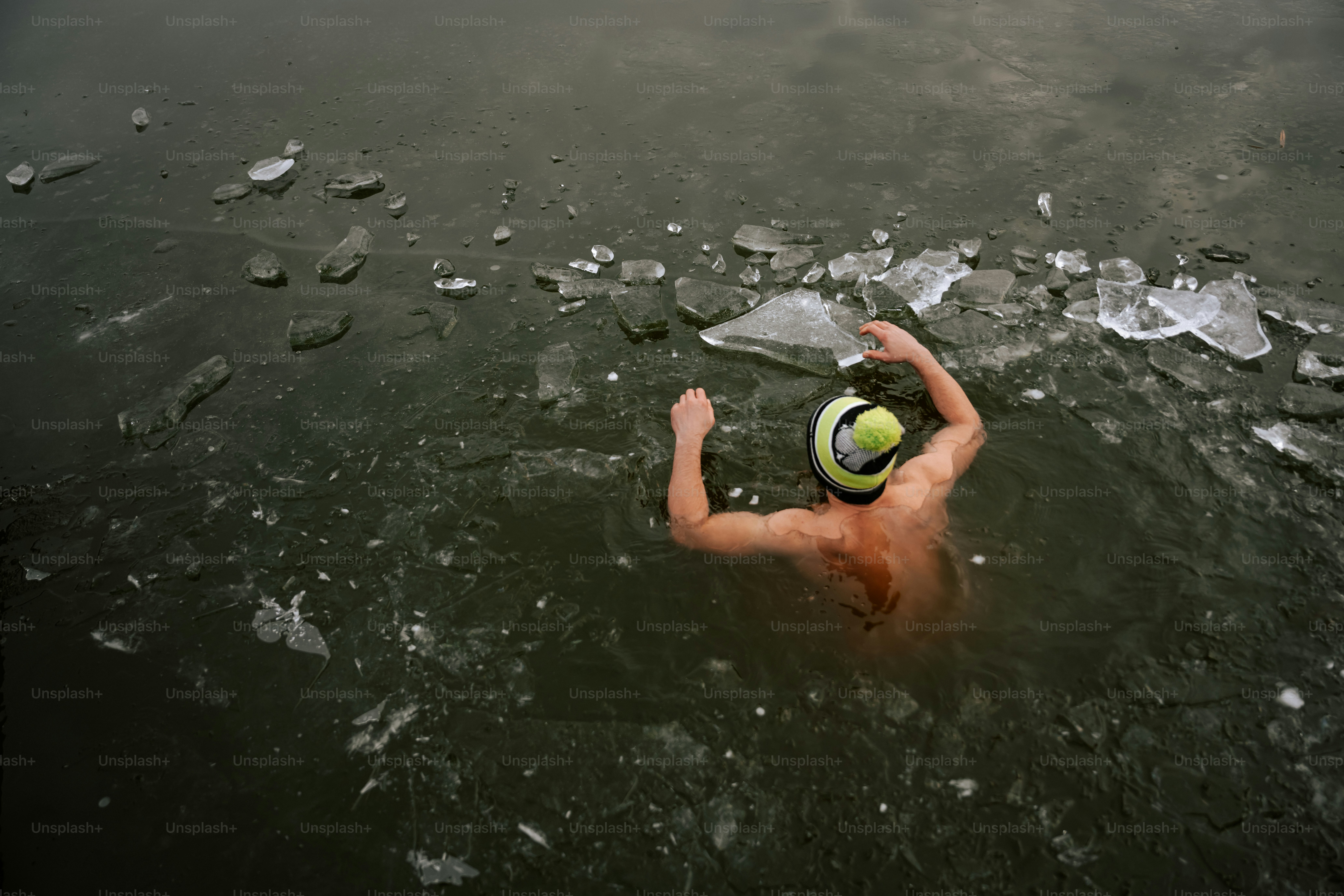 A man in the water with a ball in his hand
