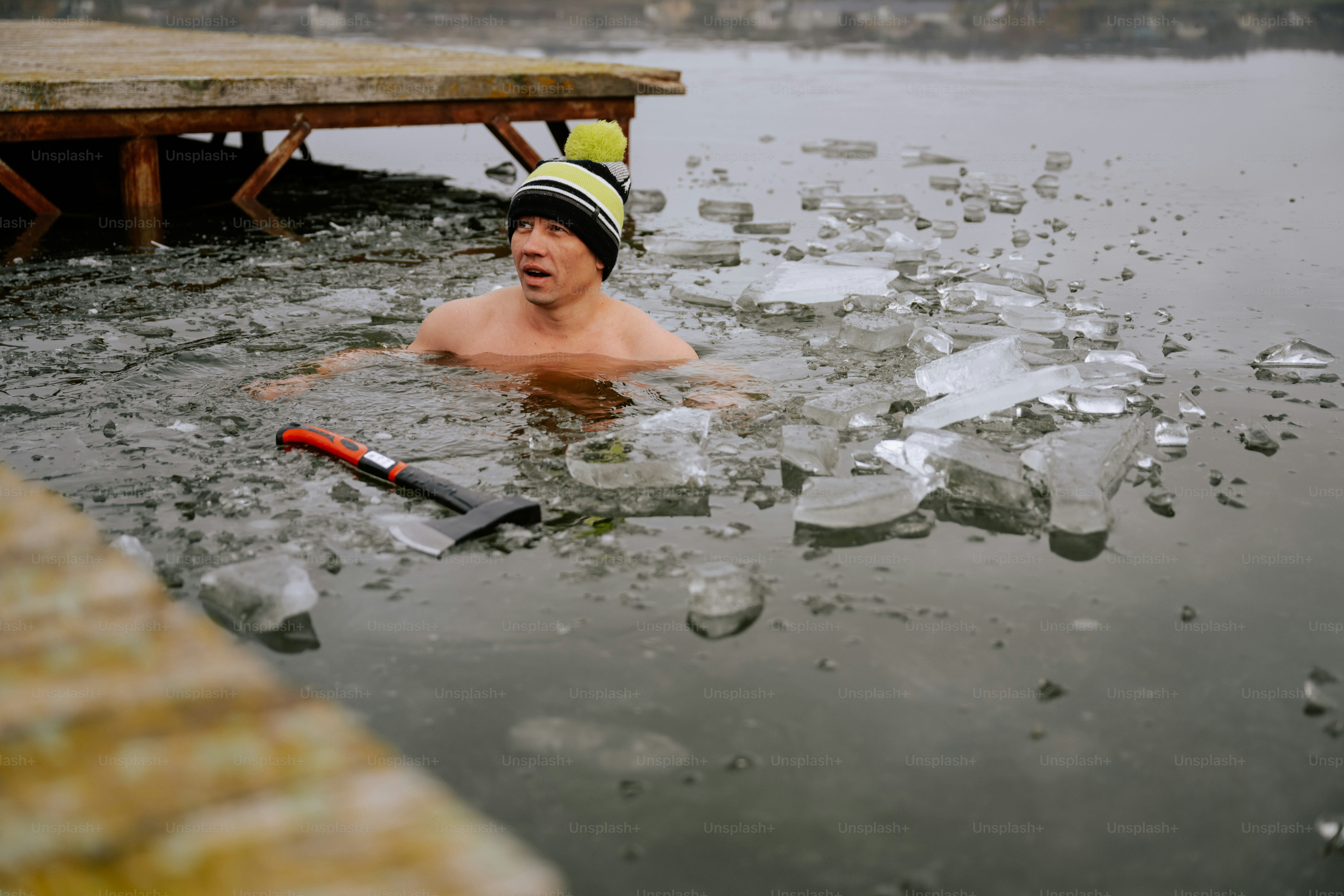 A man swimming in a body of water