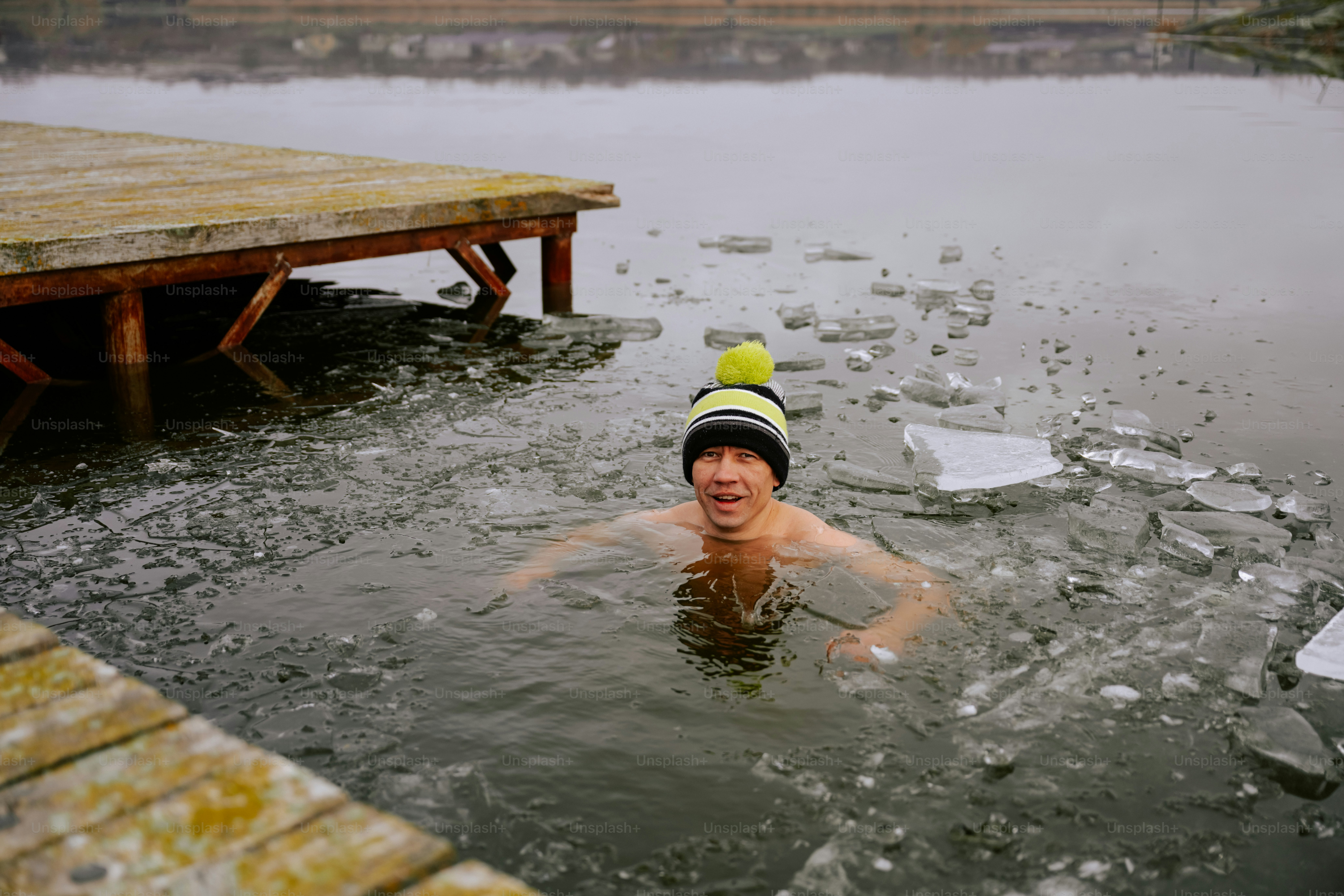 A man swimming in a body of water