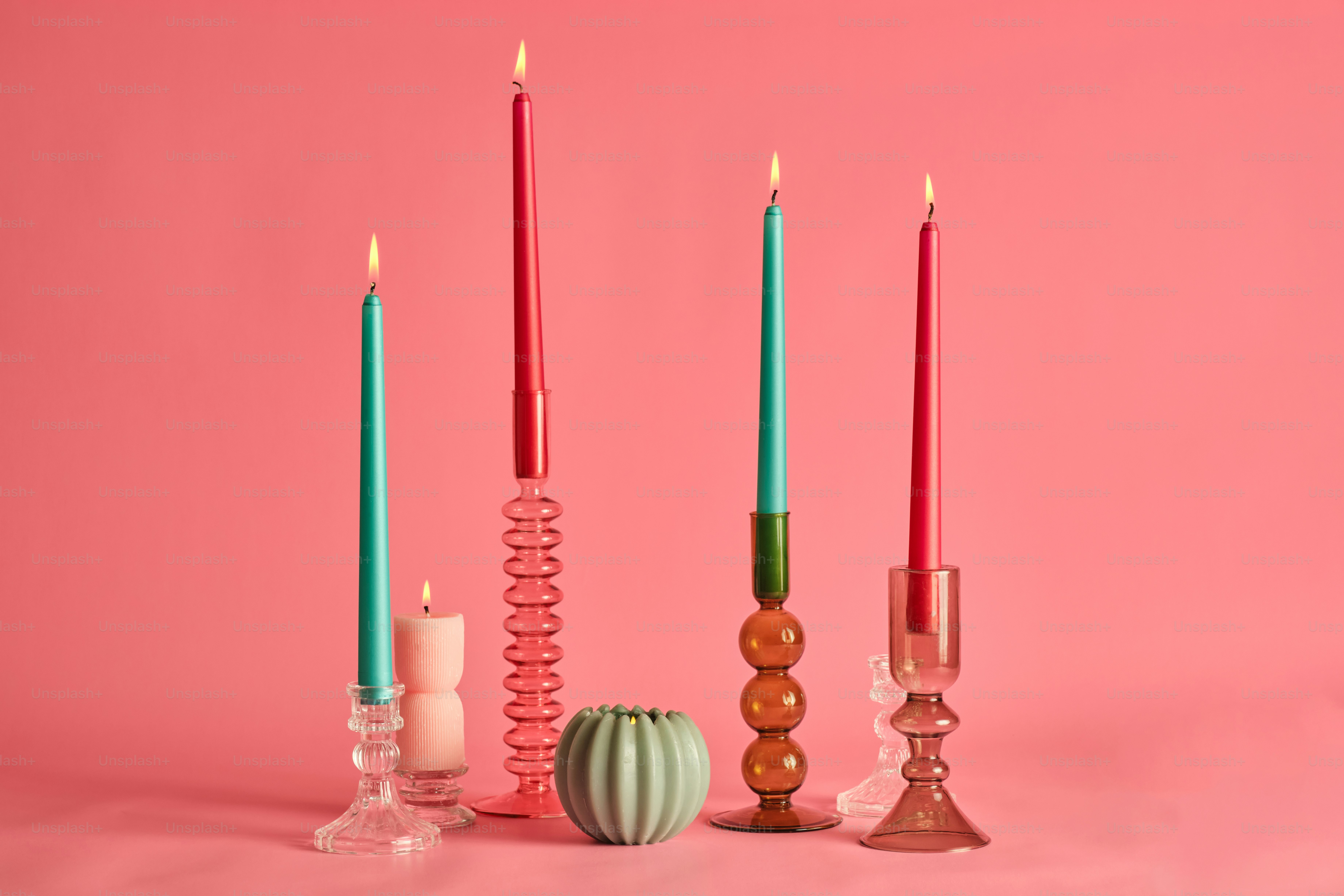 A group of candles sitting next to each other