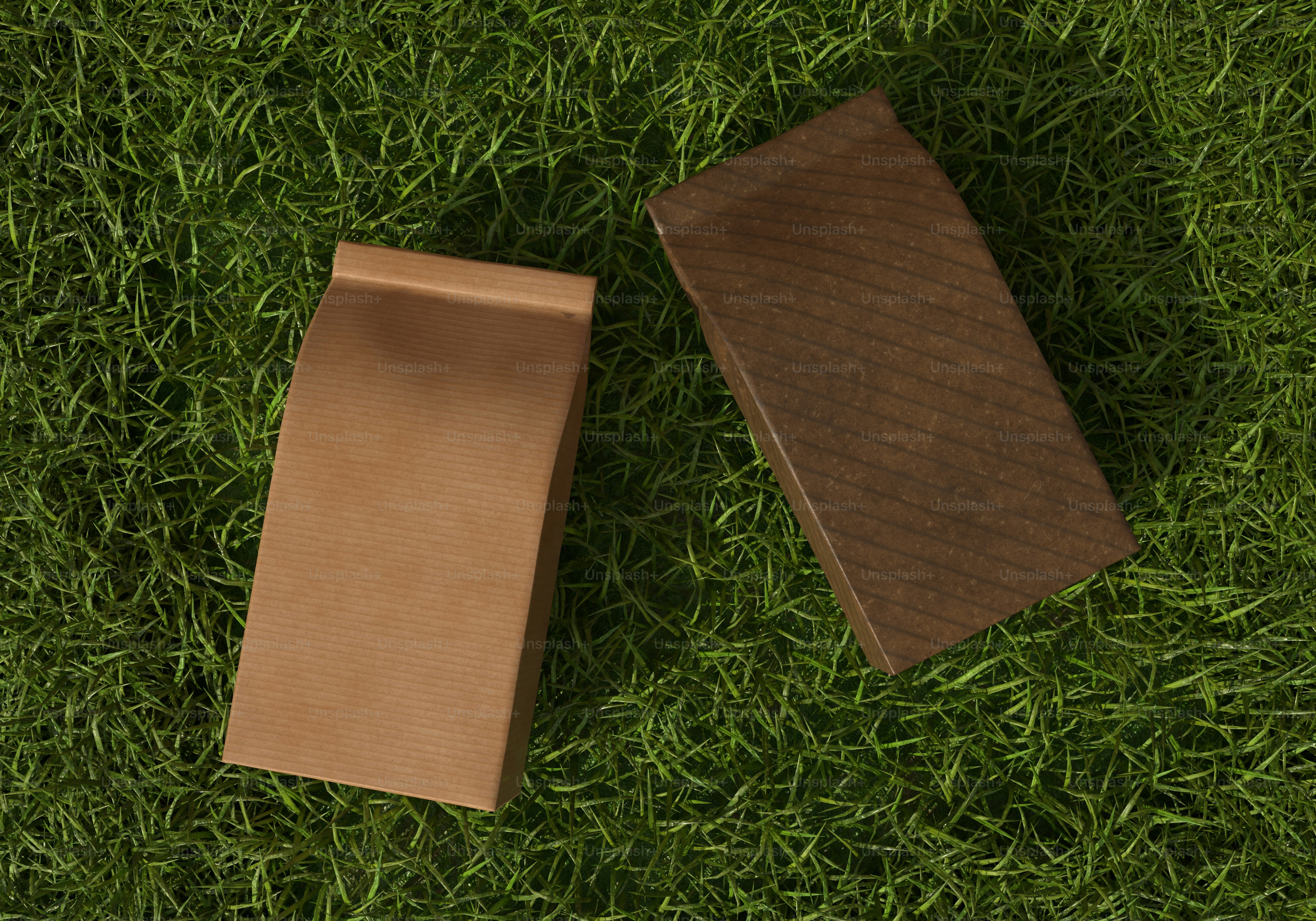 A brown box sitting on top of a lush green field