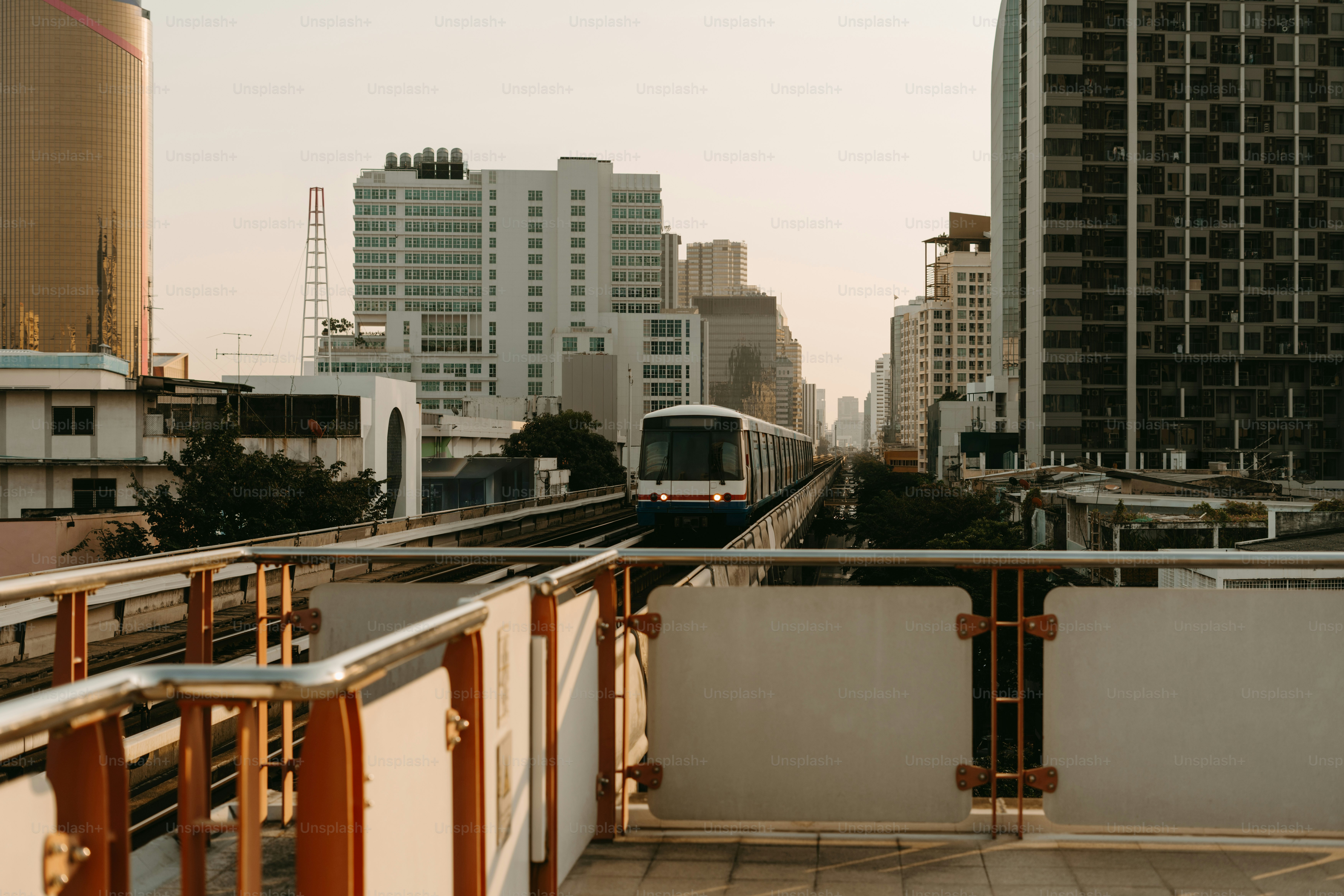 A view of a city with a train on the tracks