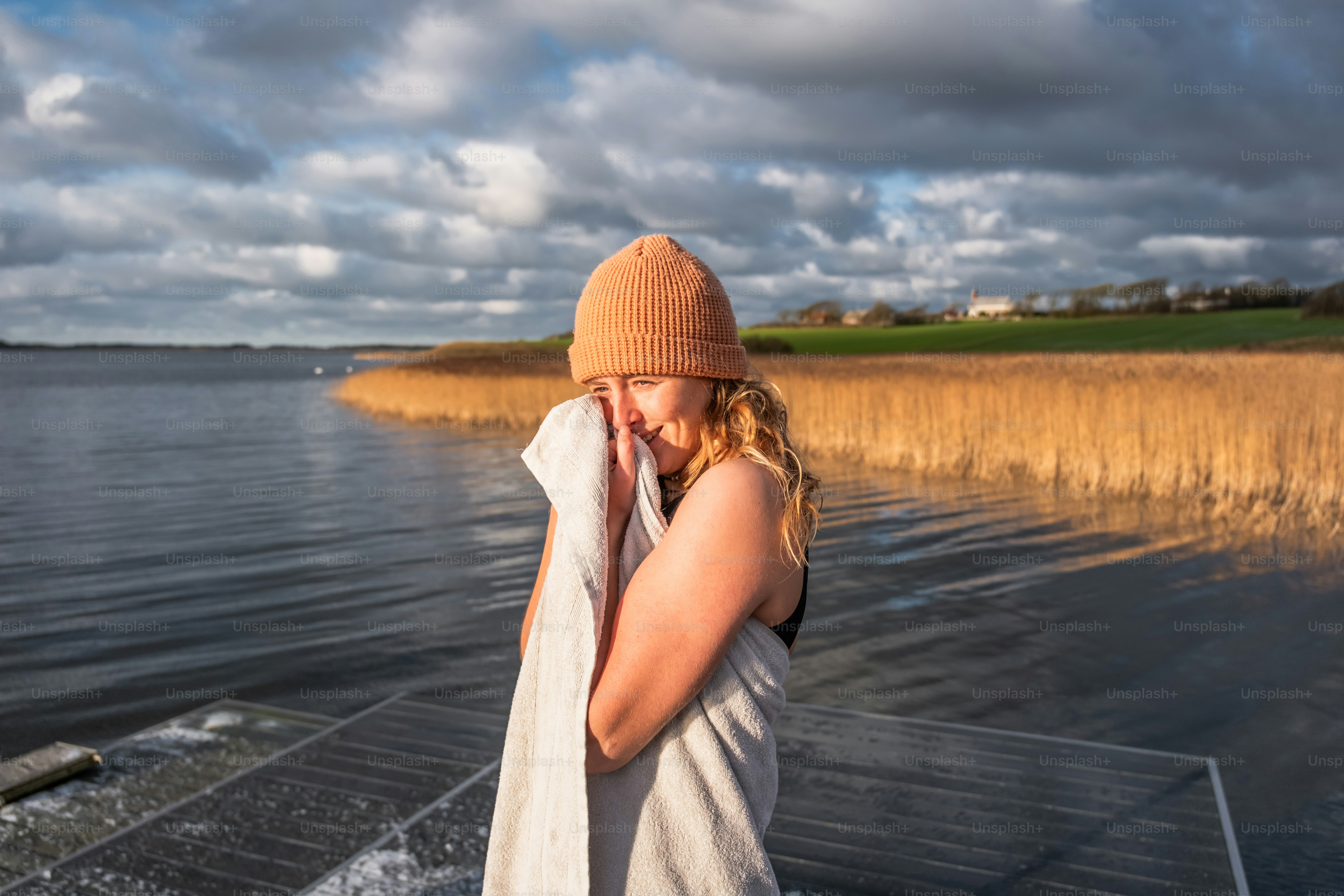 A woman standing on a boat in the water