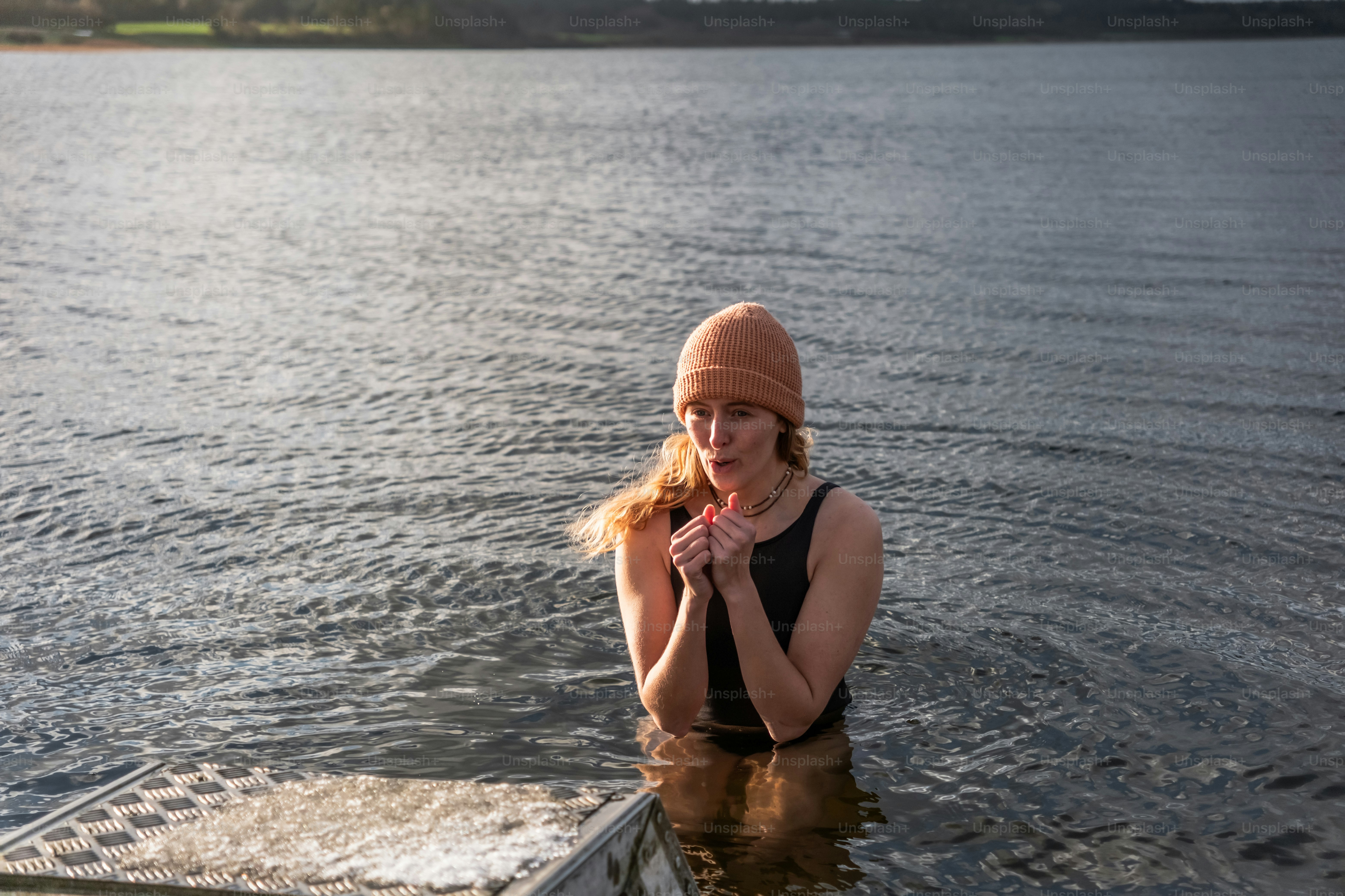 A woman standing on a boat in the water