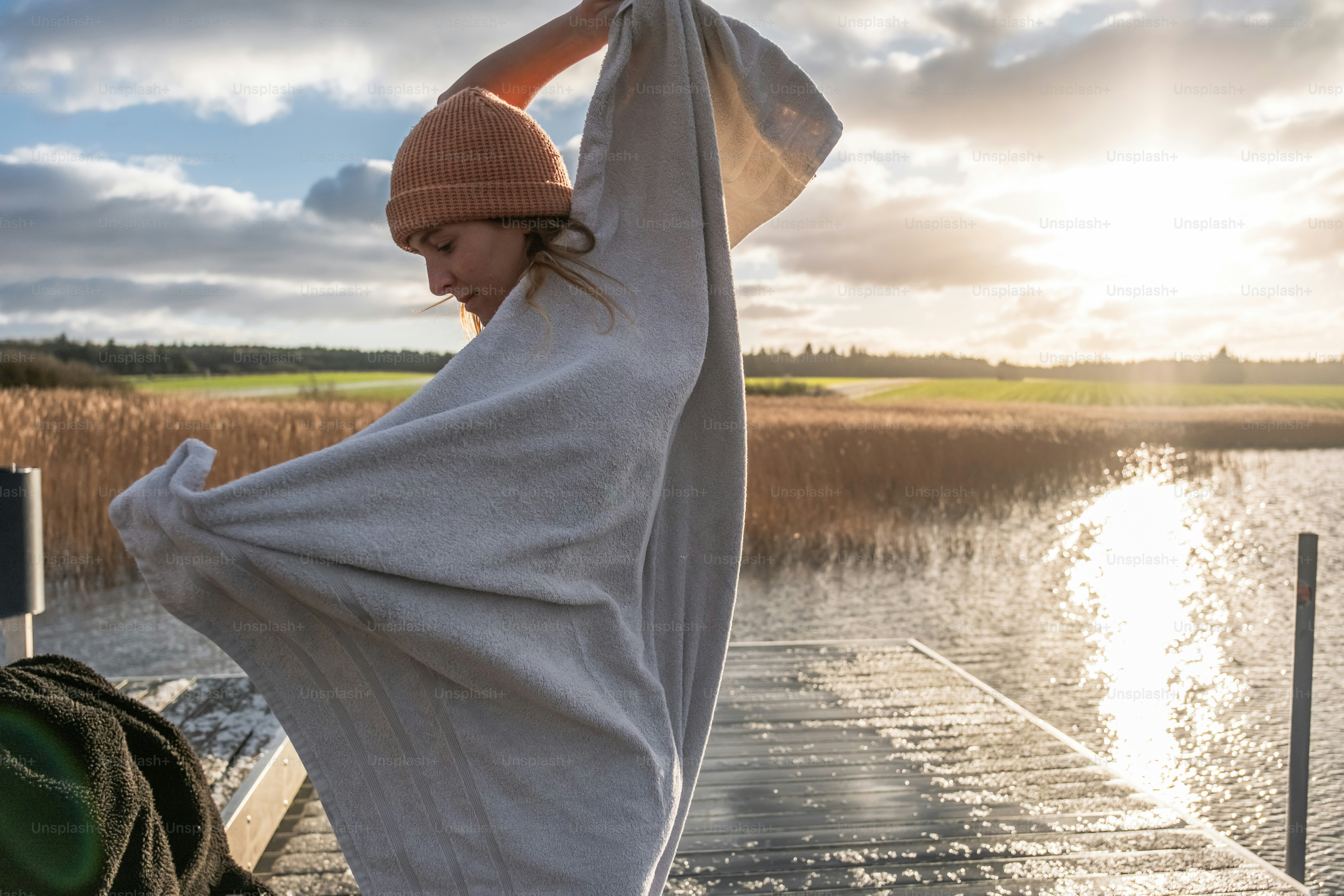 A person standing on a boat in the water