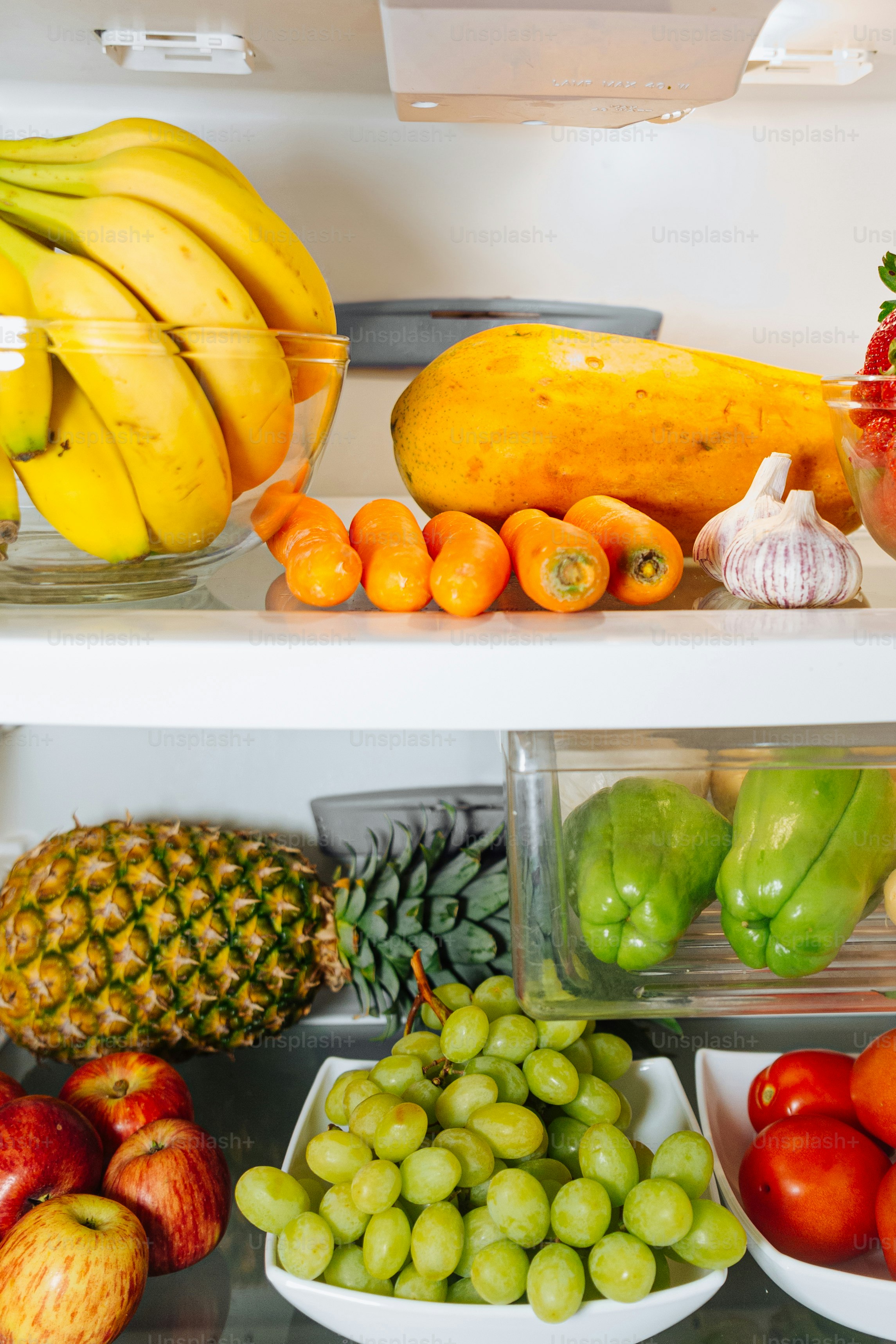 A refrigerator filled with lots of fresh fruits and vegetables