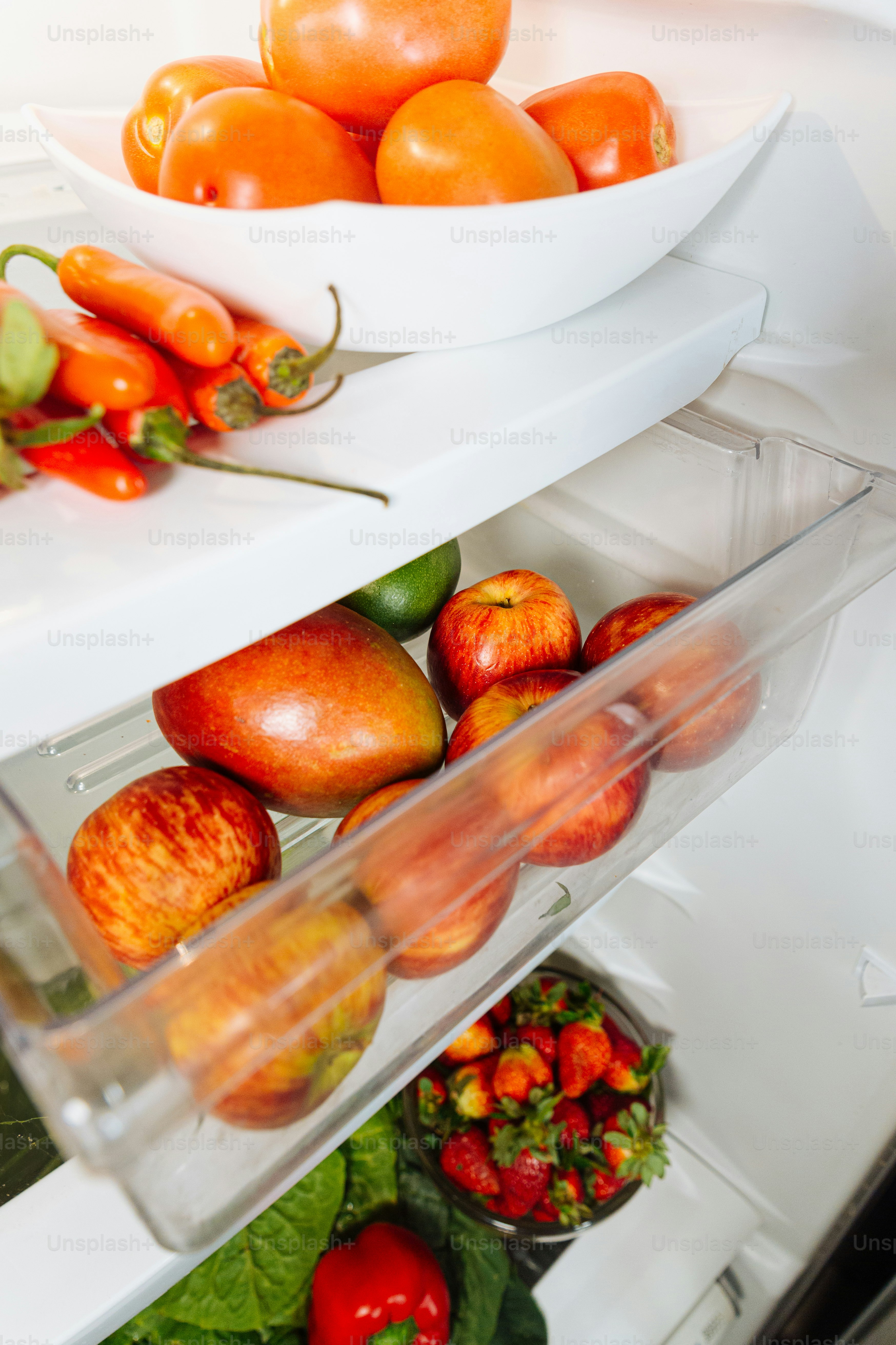 A refrigerator filled with lots of fresh fruits and vegetables
