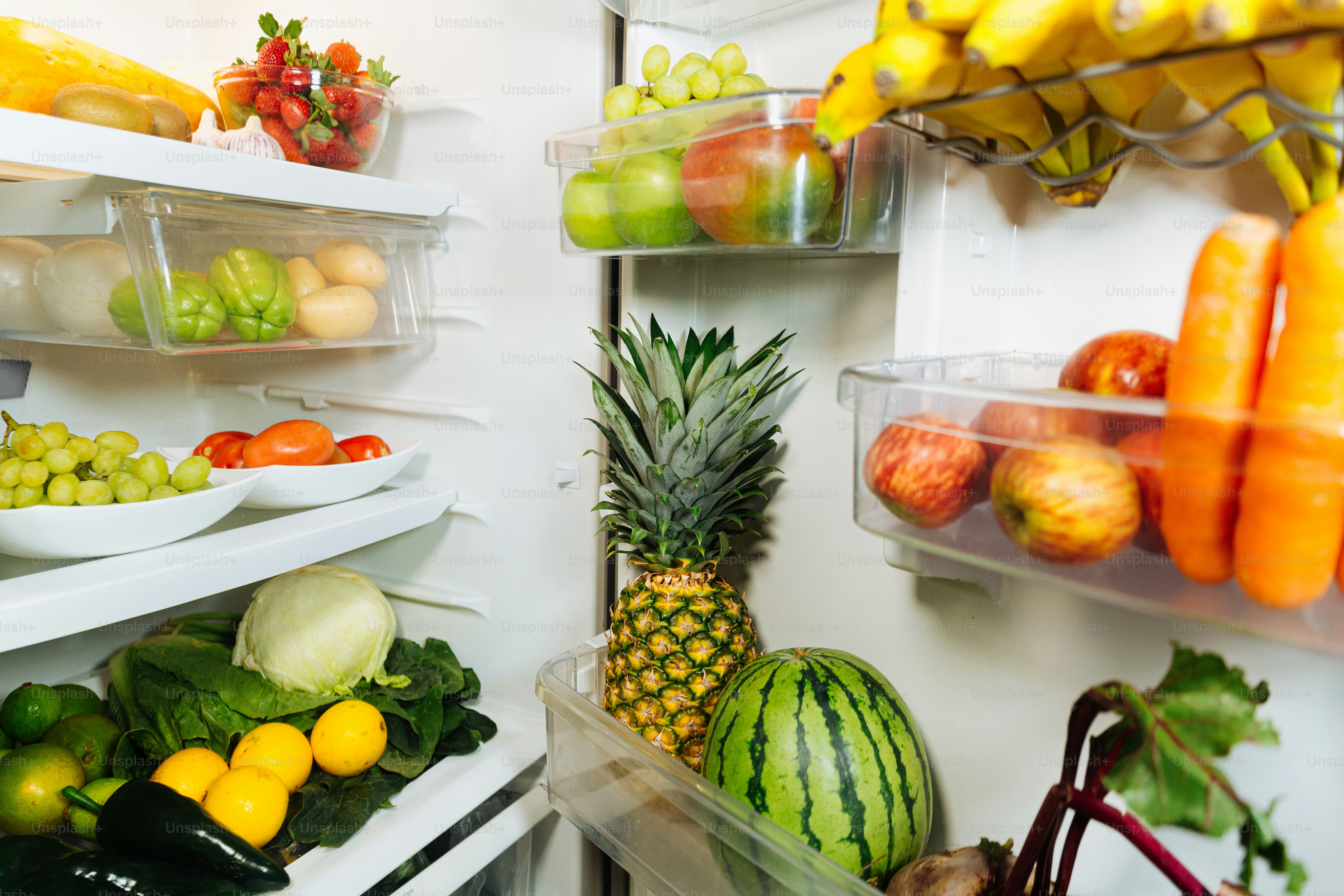 A refrigerator filled with lots of fresh fruits and vegetables