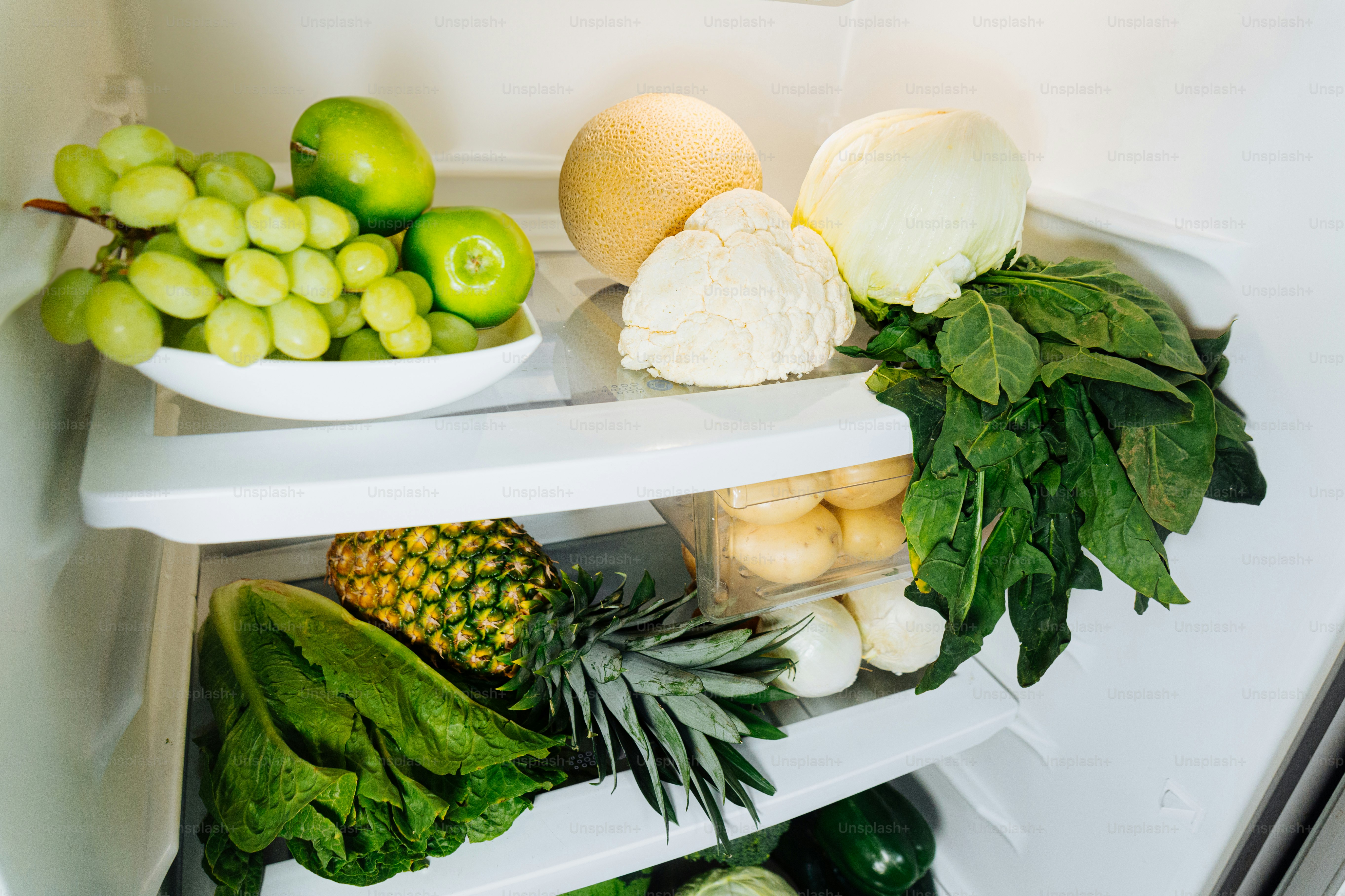 A refrigerator filled with lots of fresh fruits and vegetables