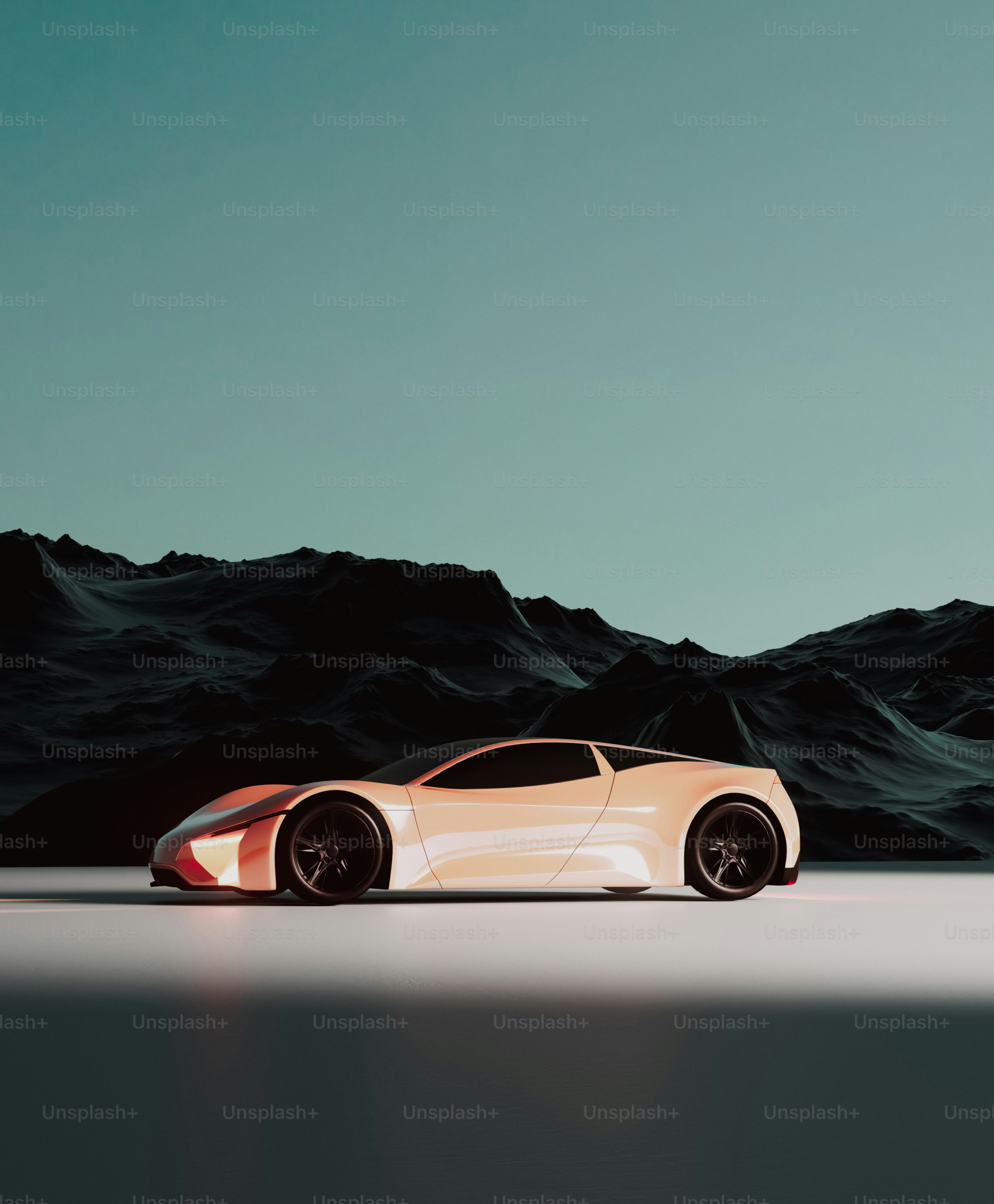 A white sports car in front of a mountain range