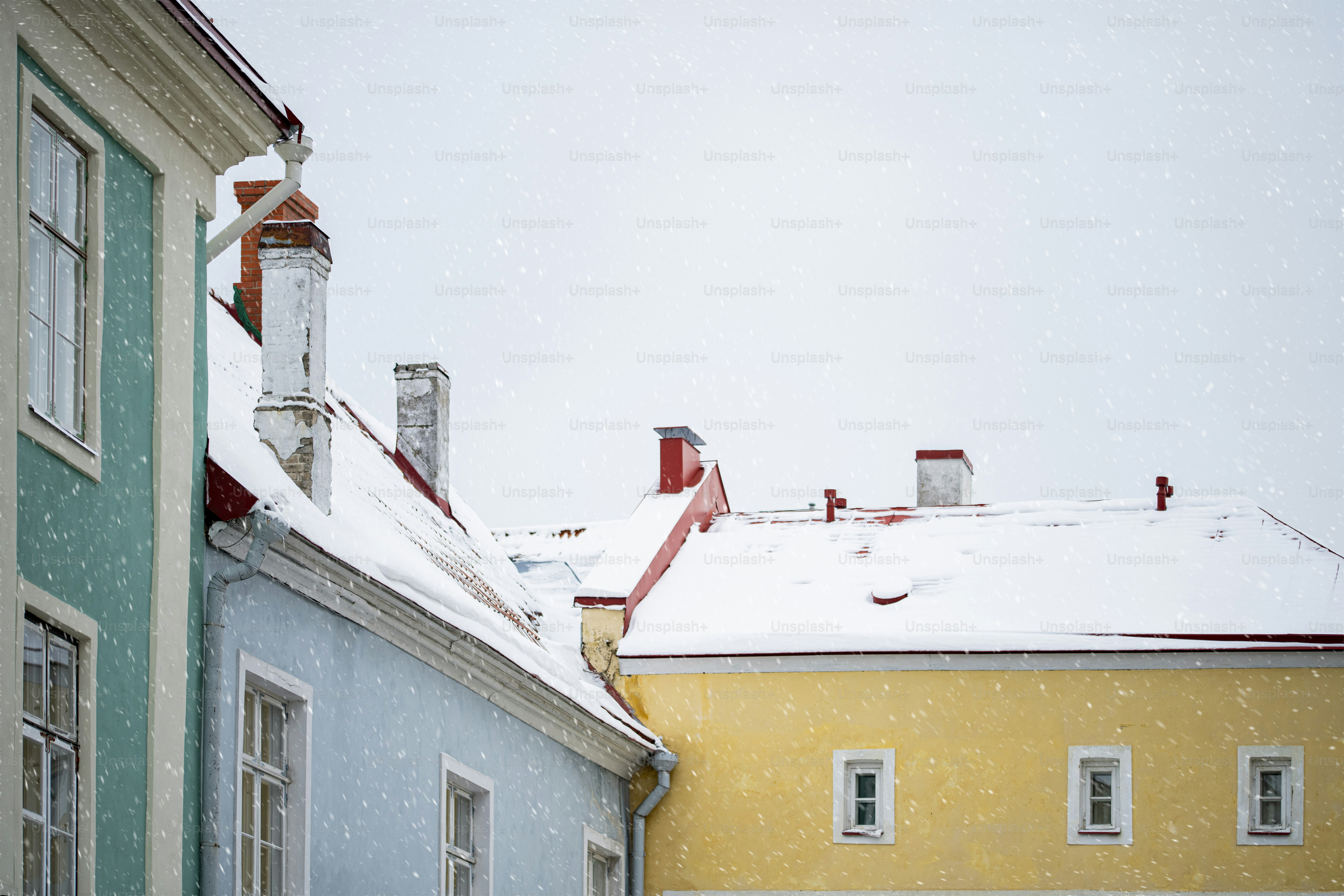 A couple of buildings that have snow on them