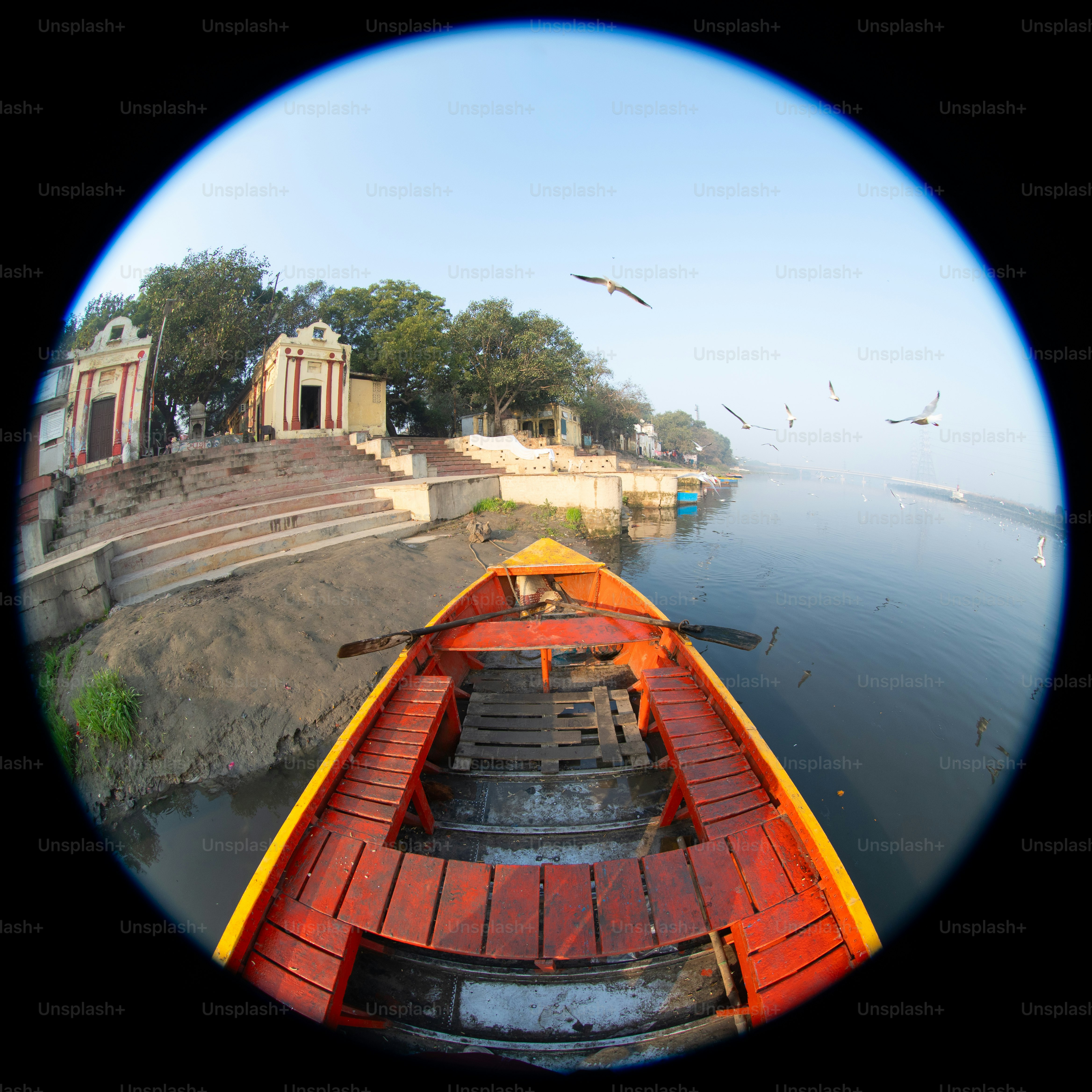 A view of a boat in the water through a fish eye lens