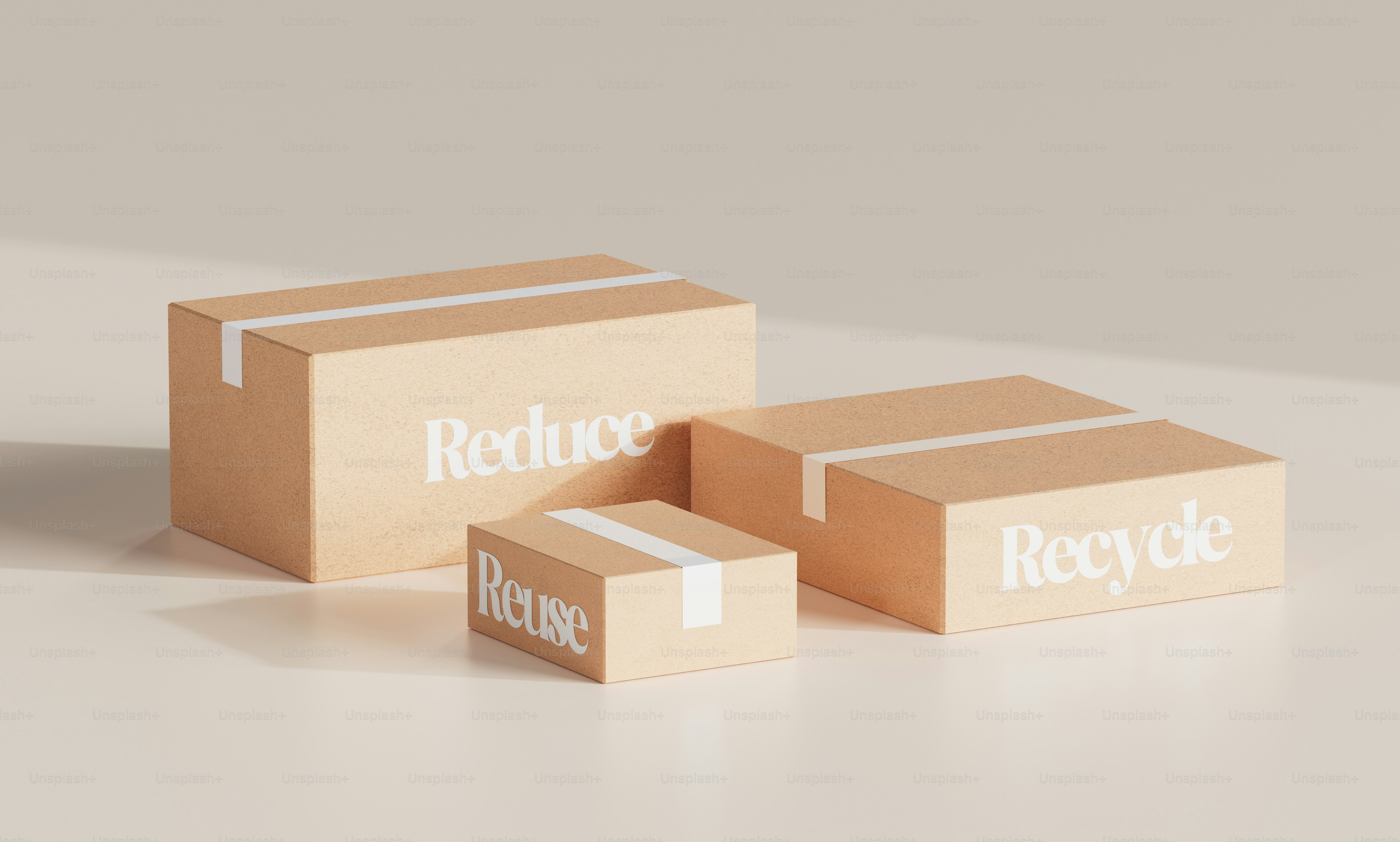 Three boxes sitting on top of a white table