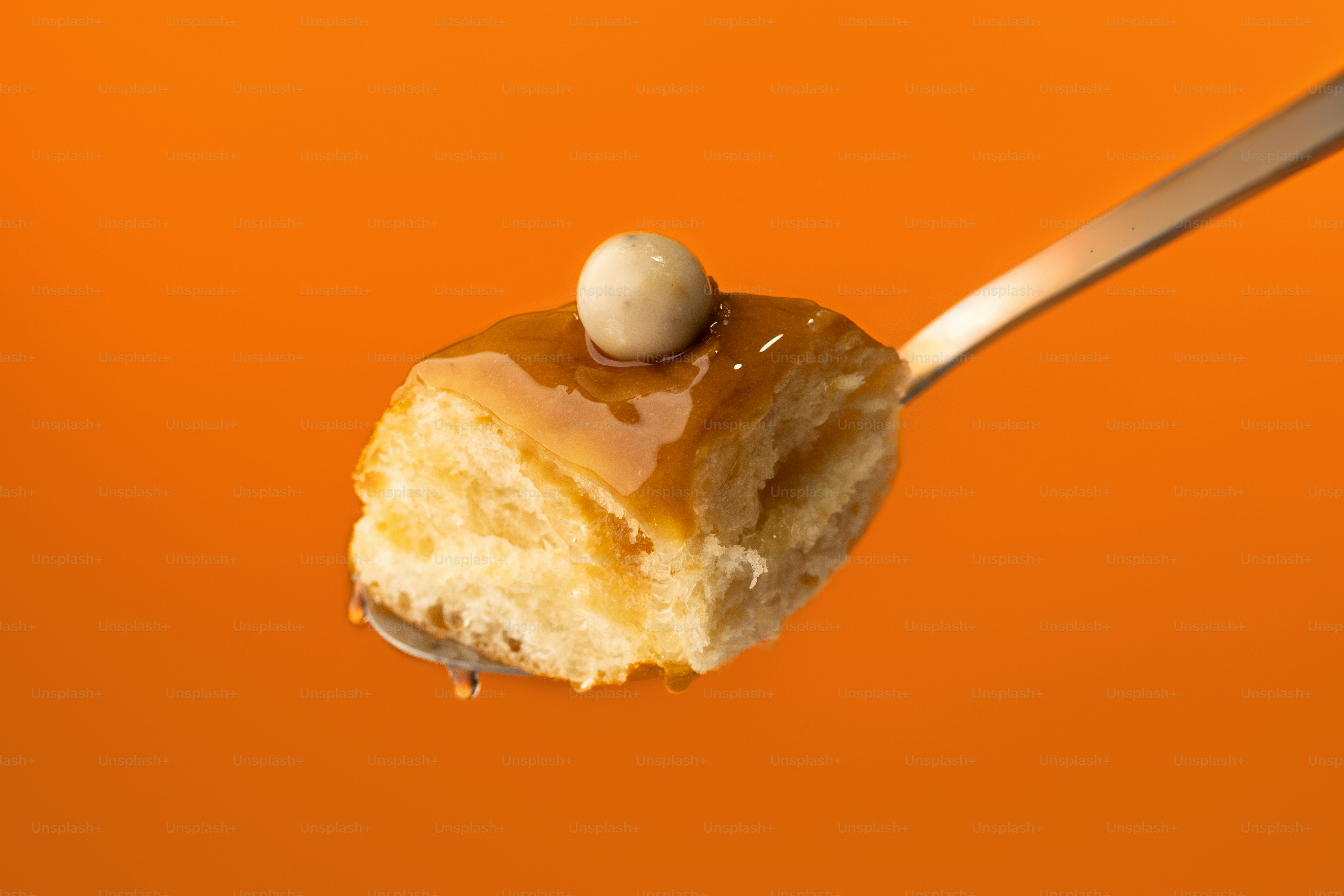 A spoon with a piece of cake on it