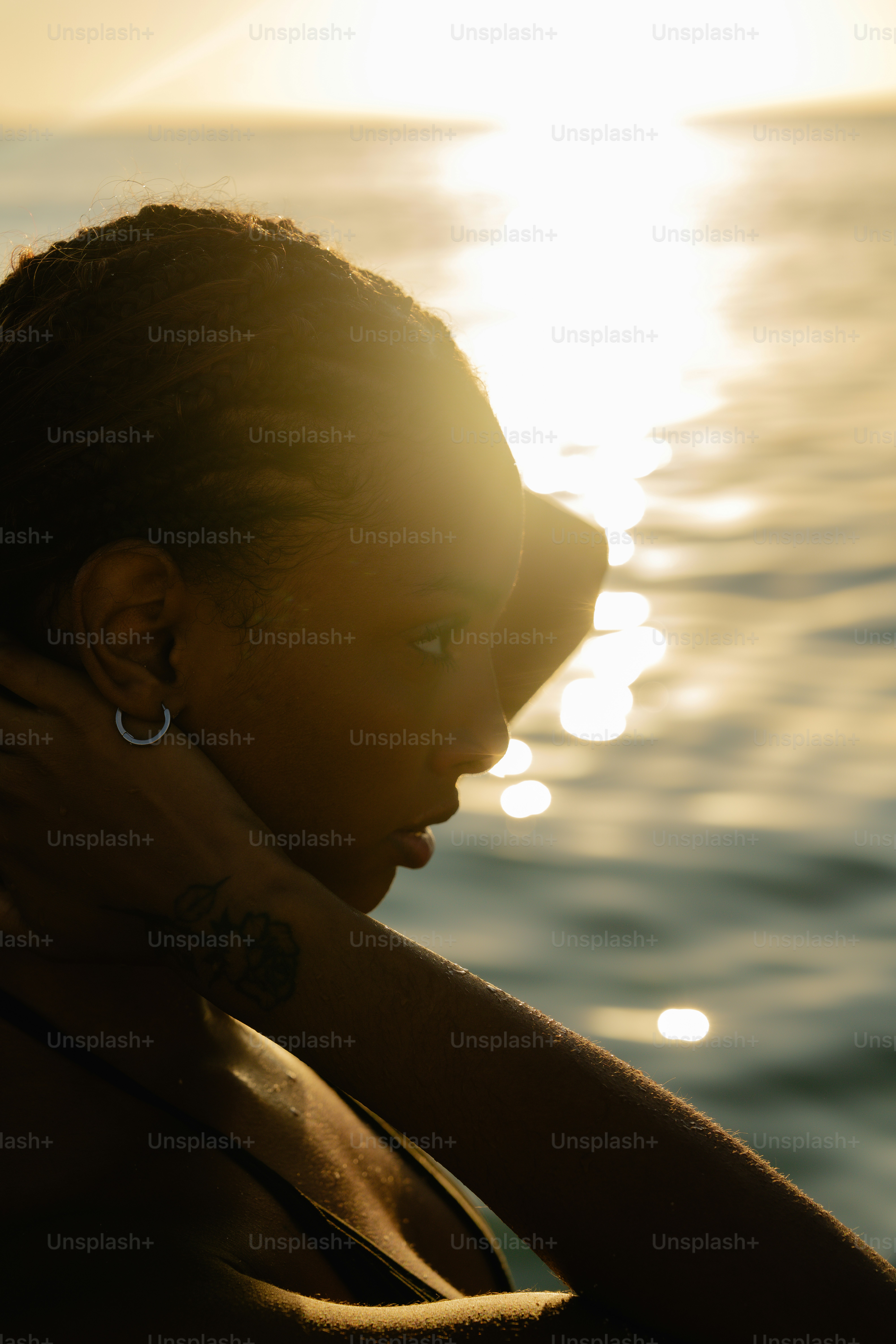 A woman swimming in the ocean at sunset photo – Girl Image on Unsplash