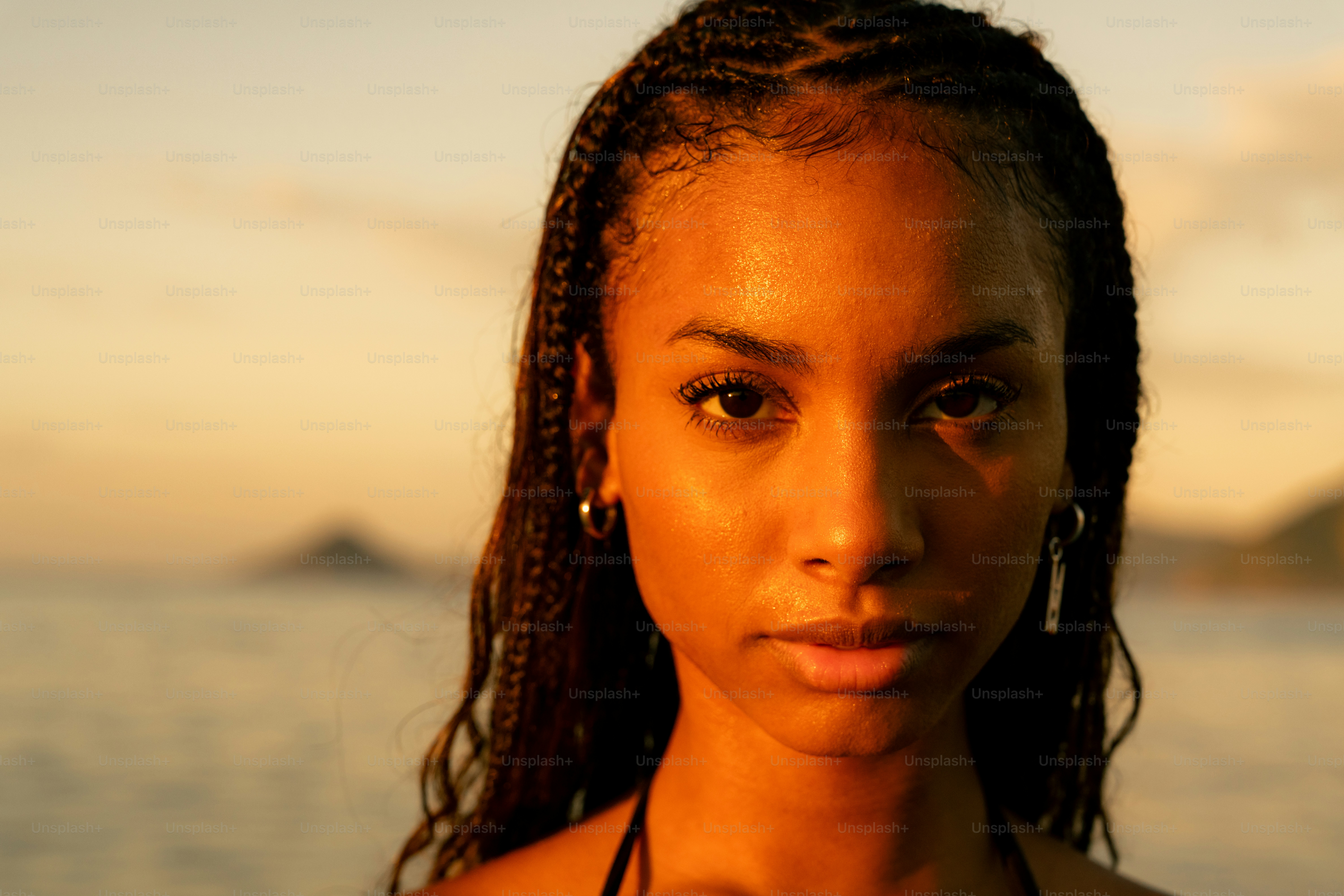 A woman standing in front of a body of water
