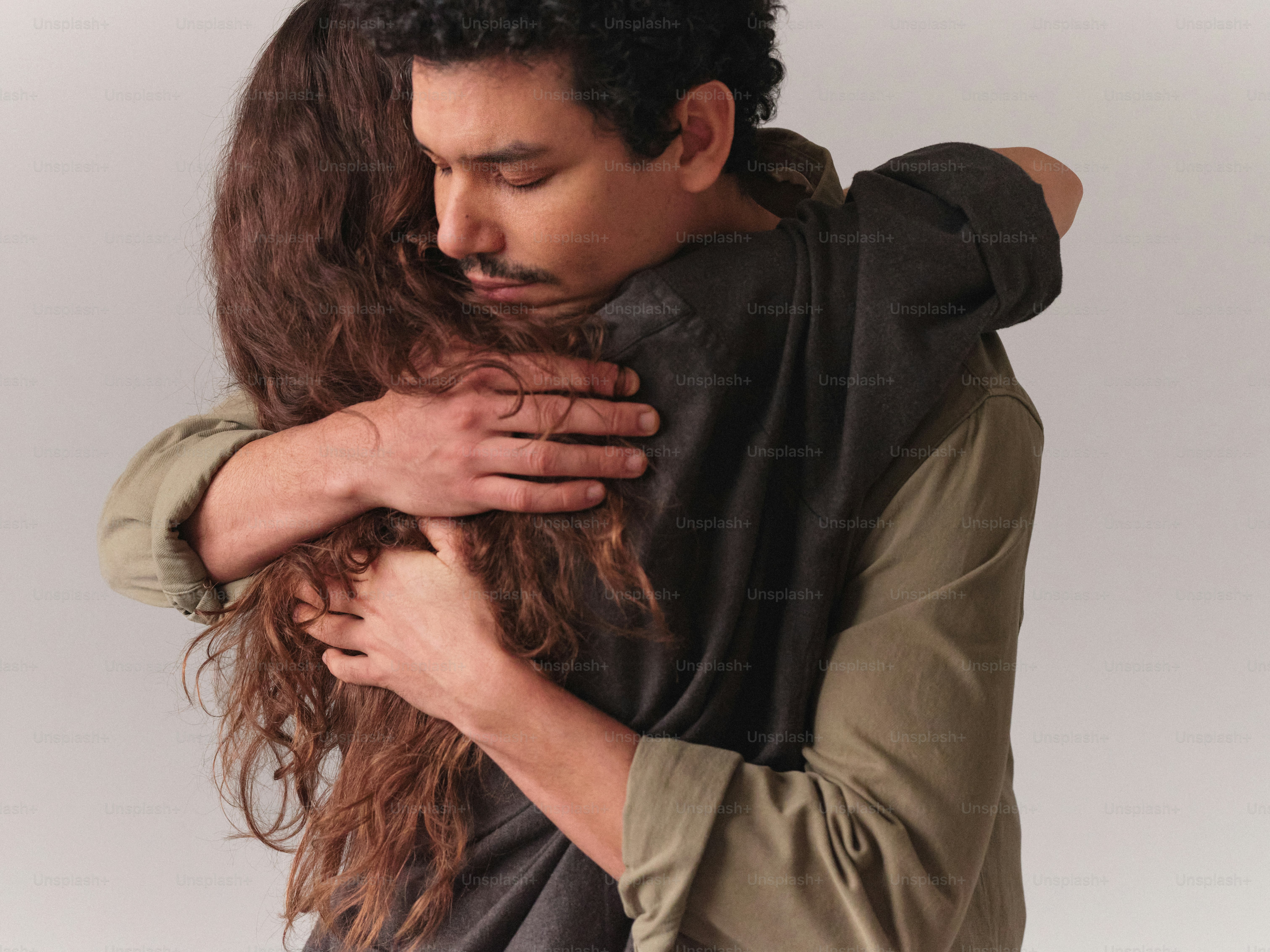 A man and a woman embracing each other