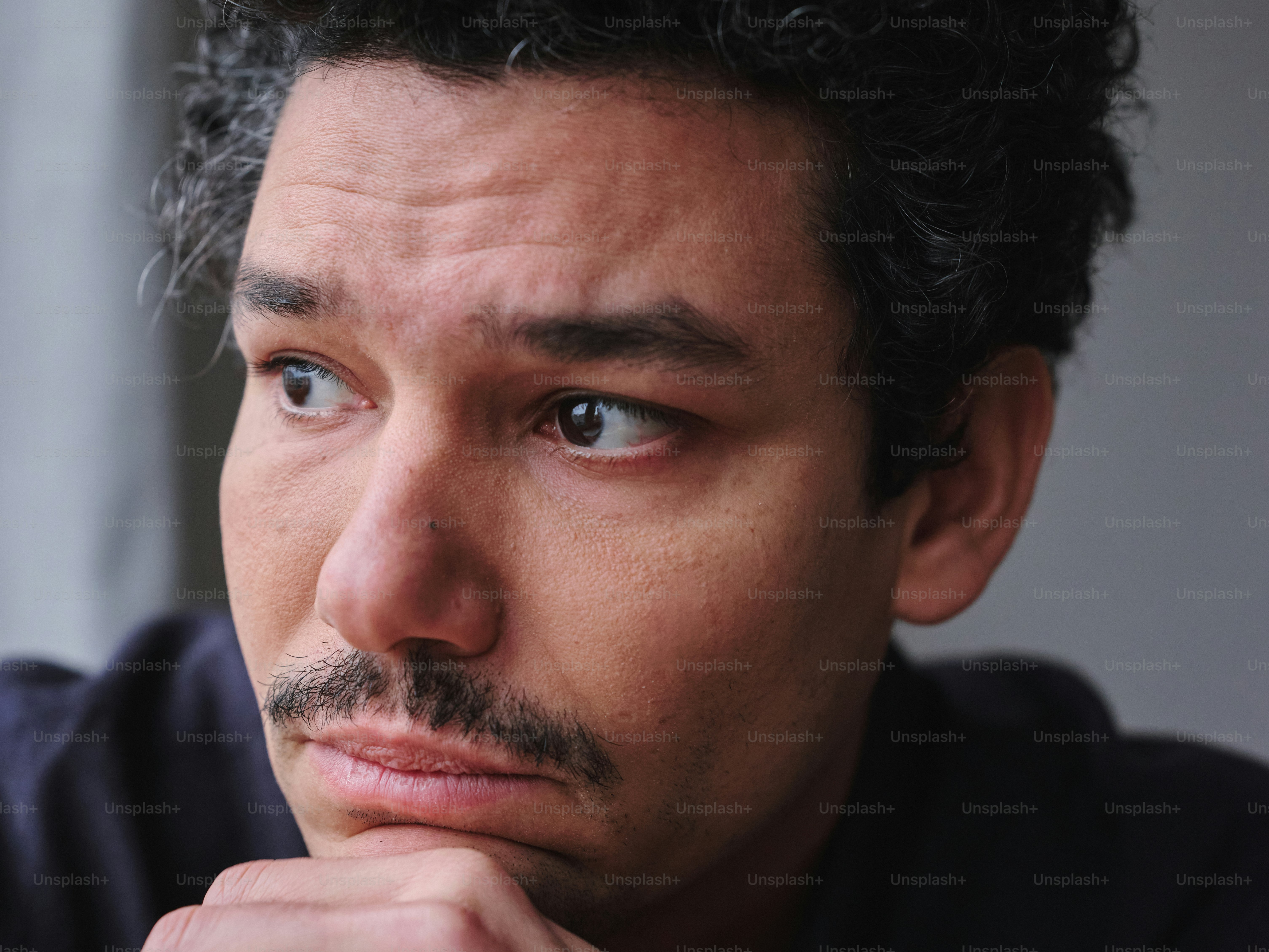 A close up of a person with a mustache
