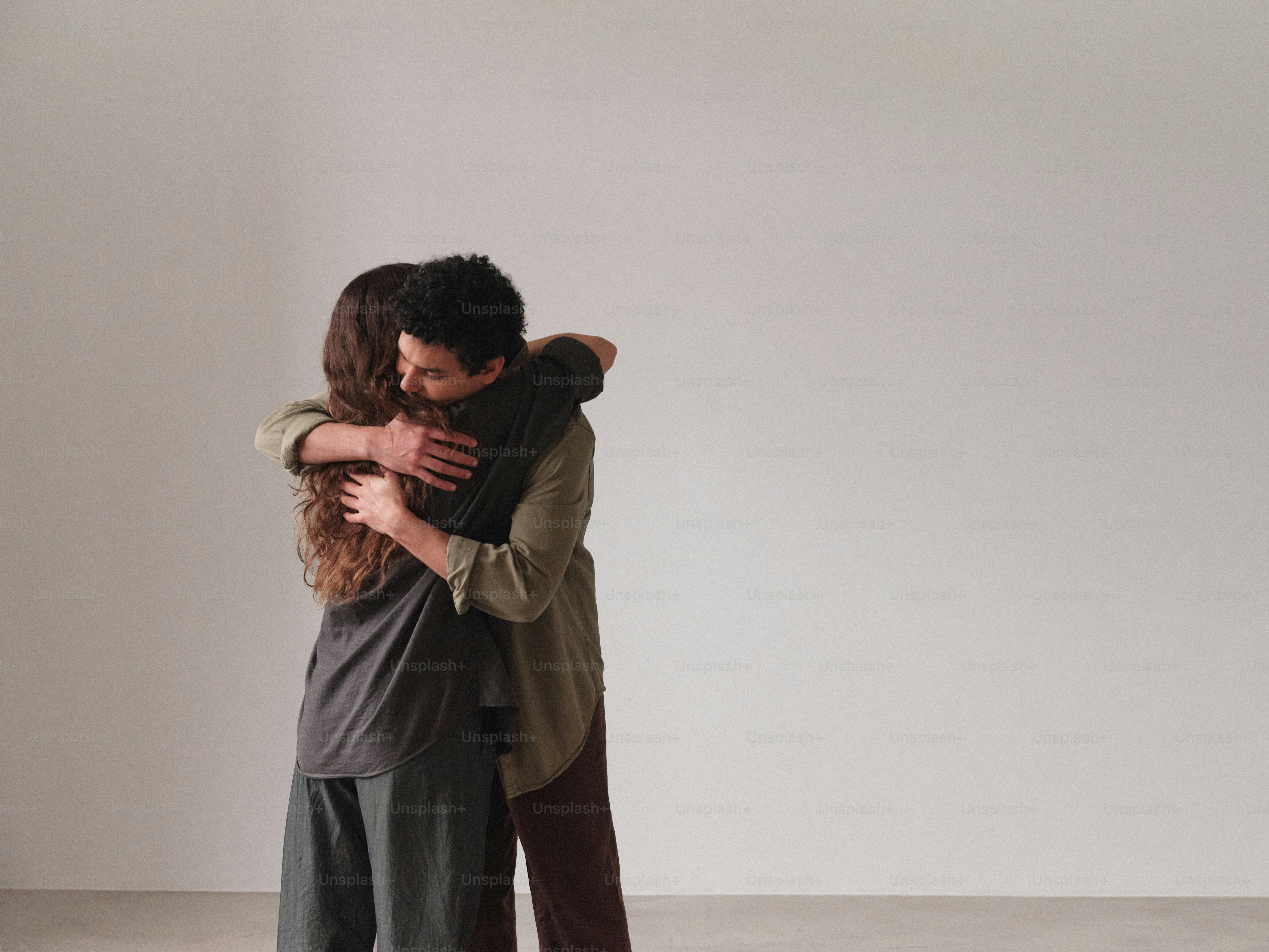 A man and a woman embracing each other