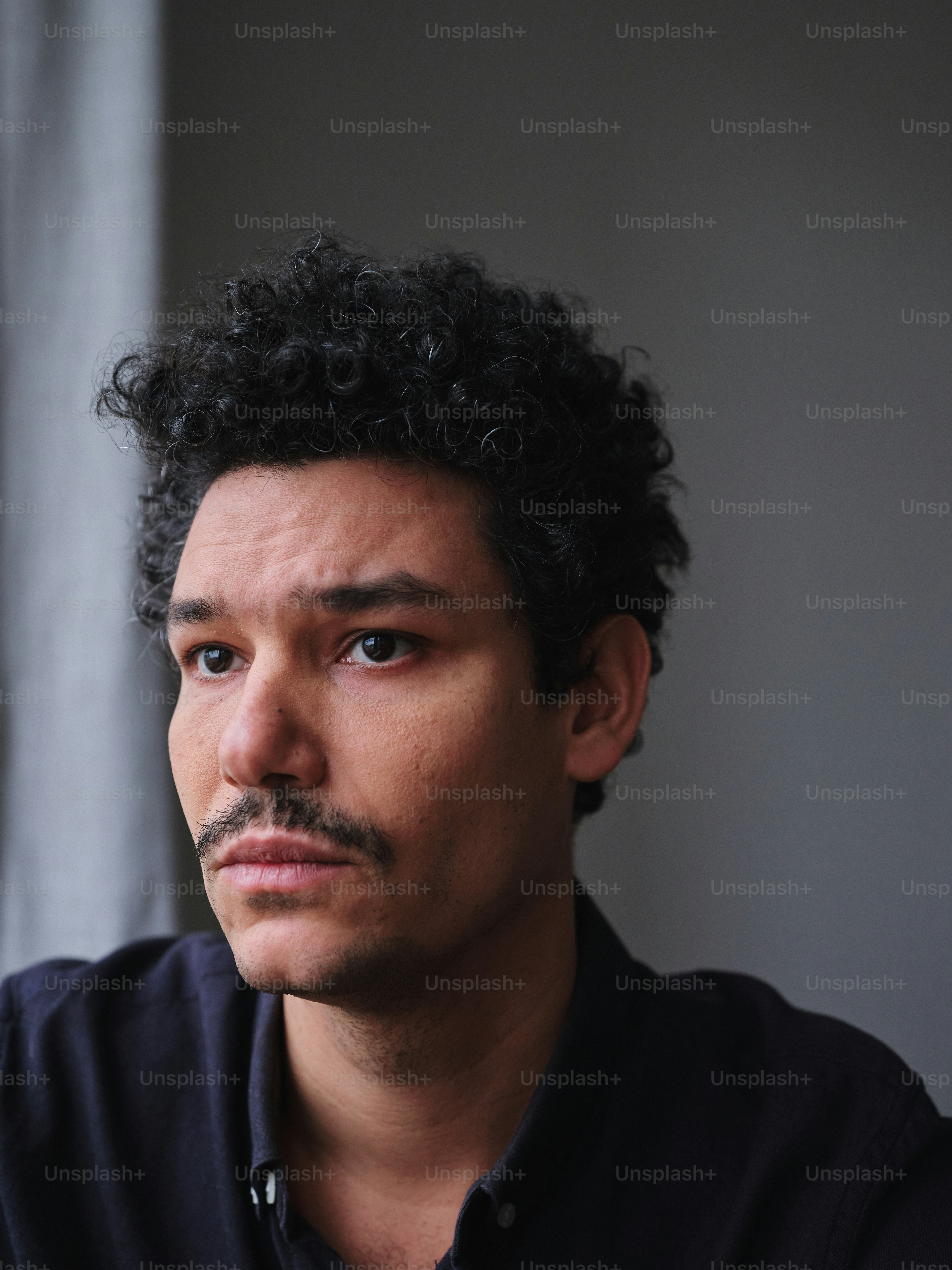 A close up of a person wearing a black shirt