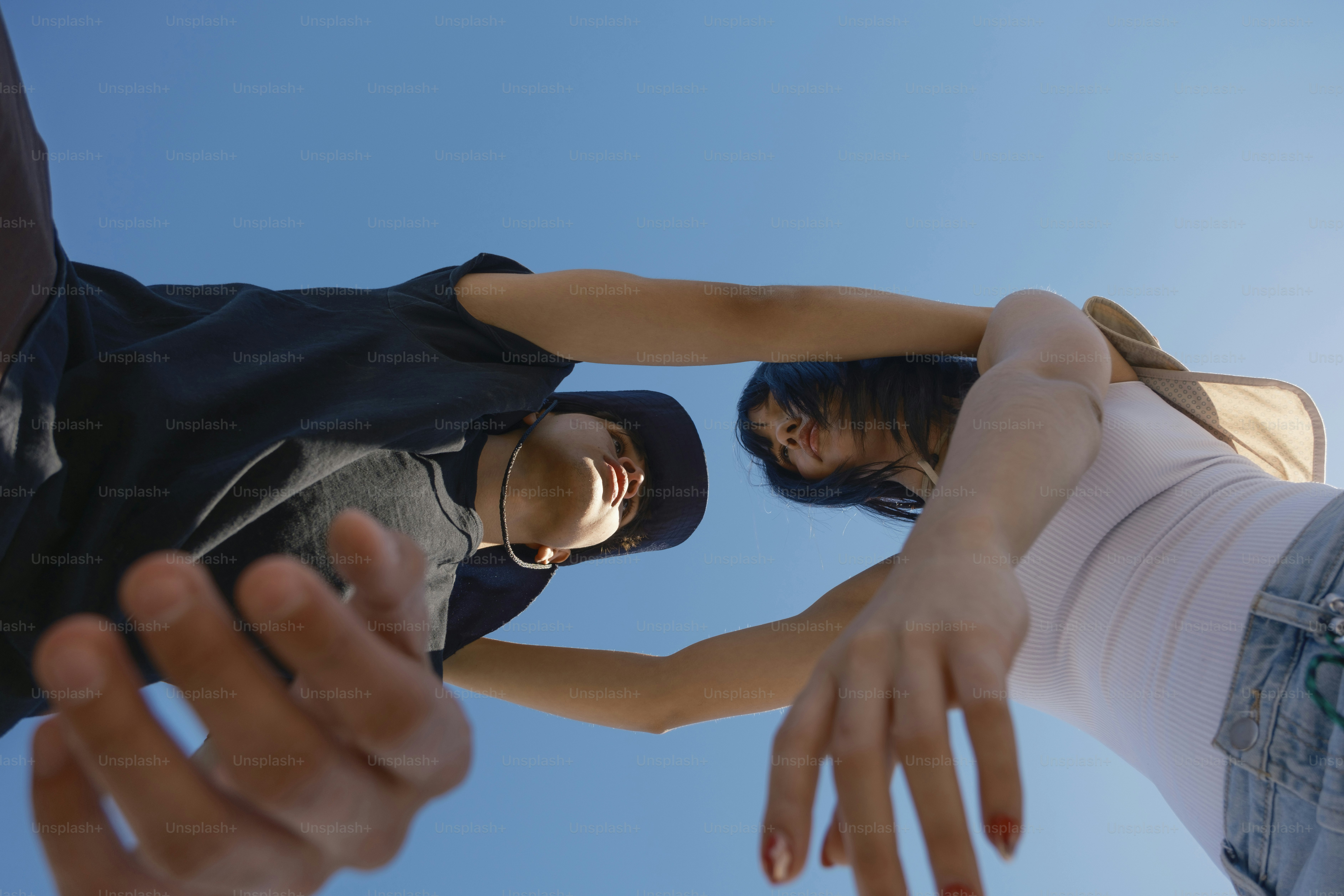 A group of people standing around each other