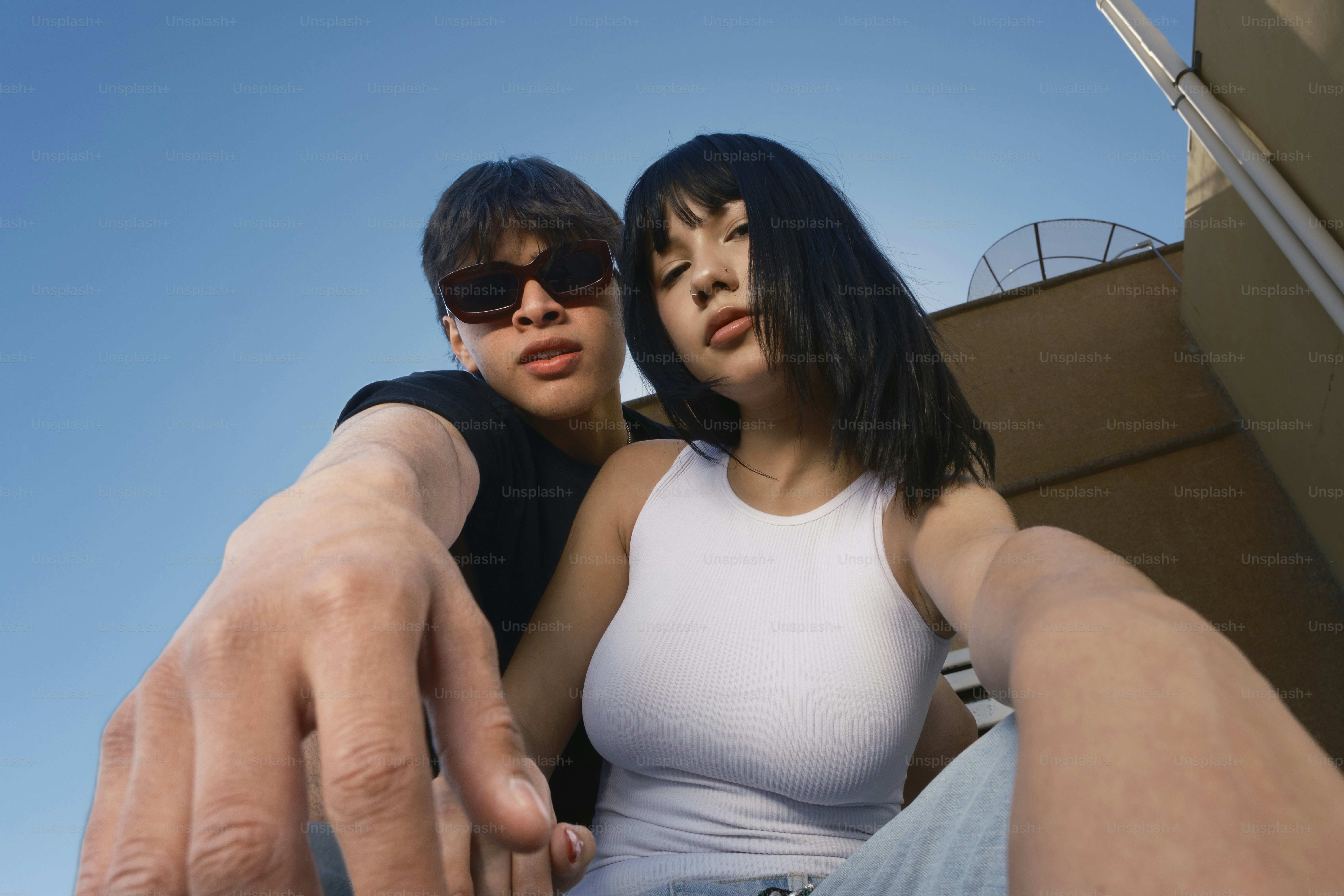 A couple of people that are pointing at something