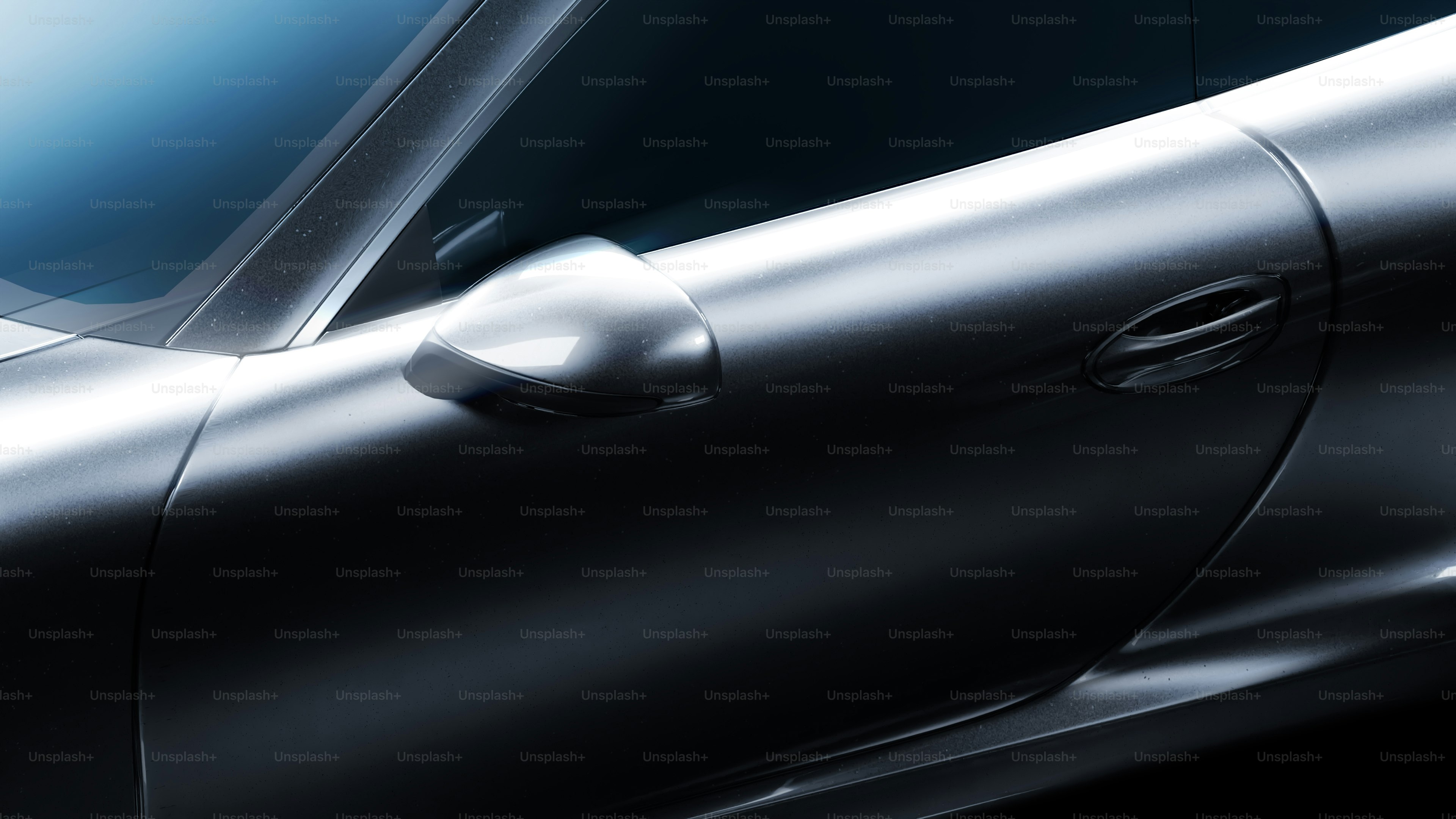 A close up of a silver car with a black background