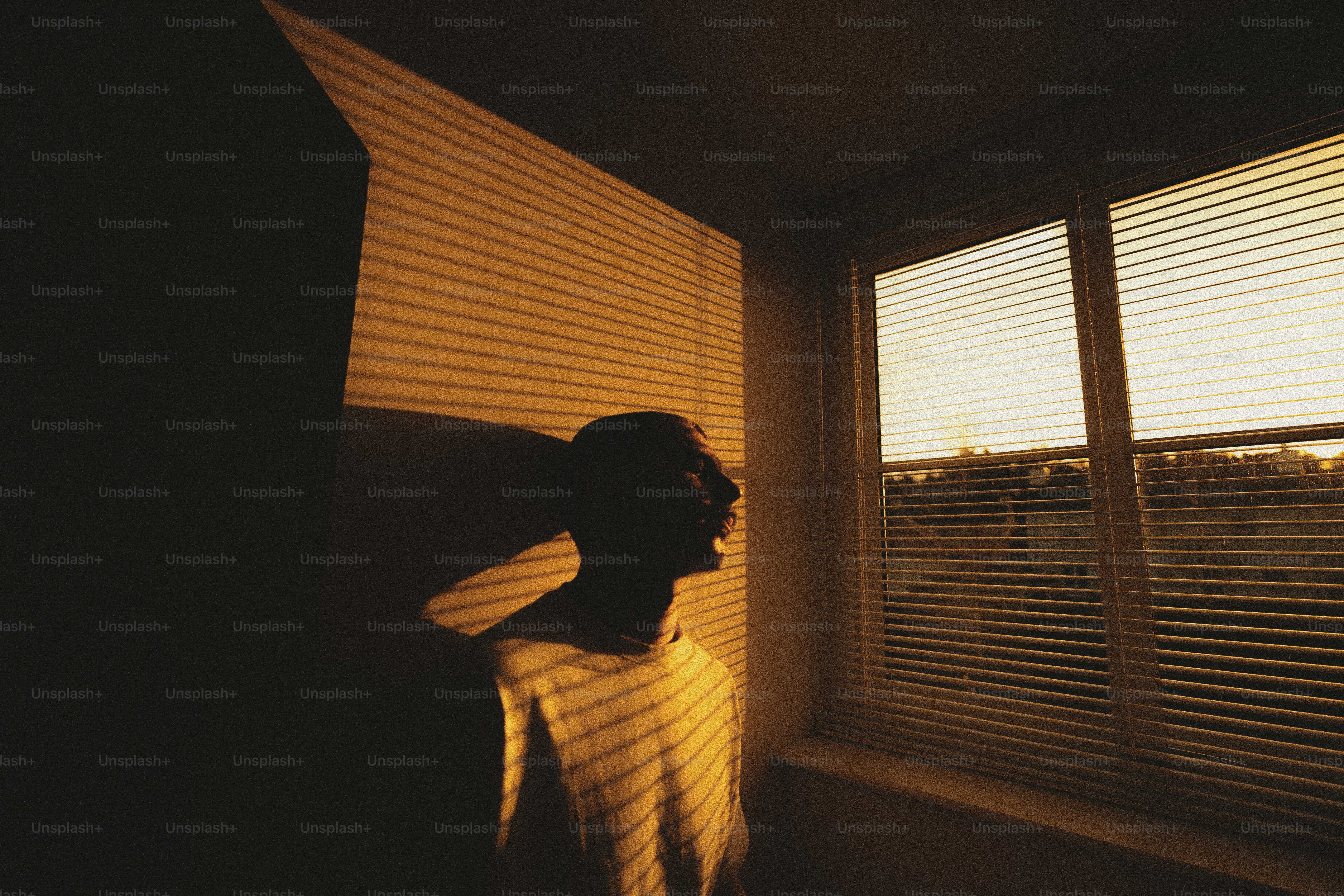 A person standing in front of a window