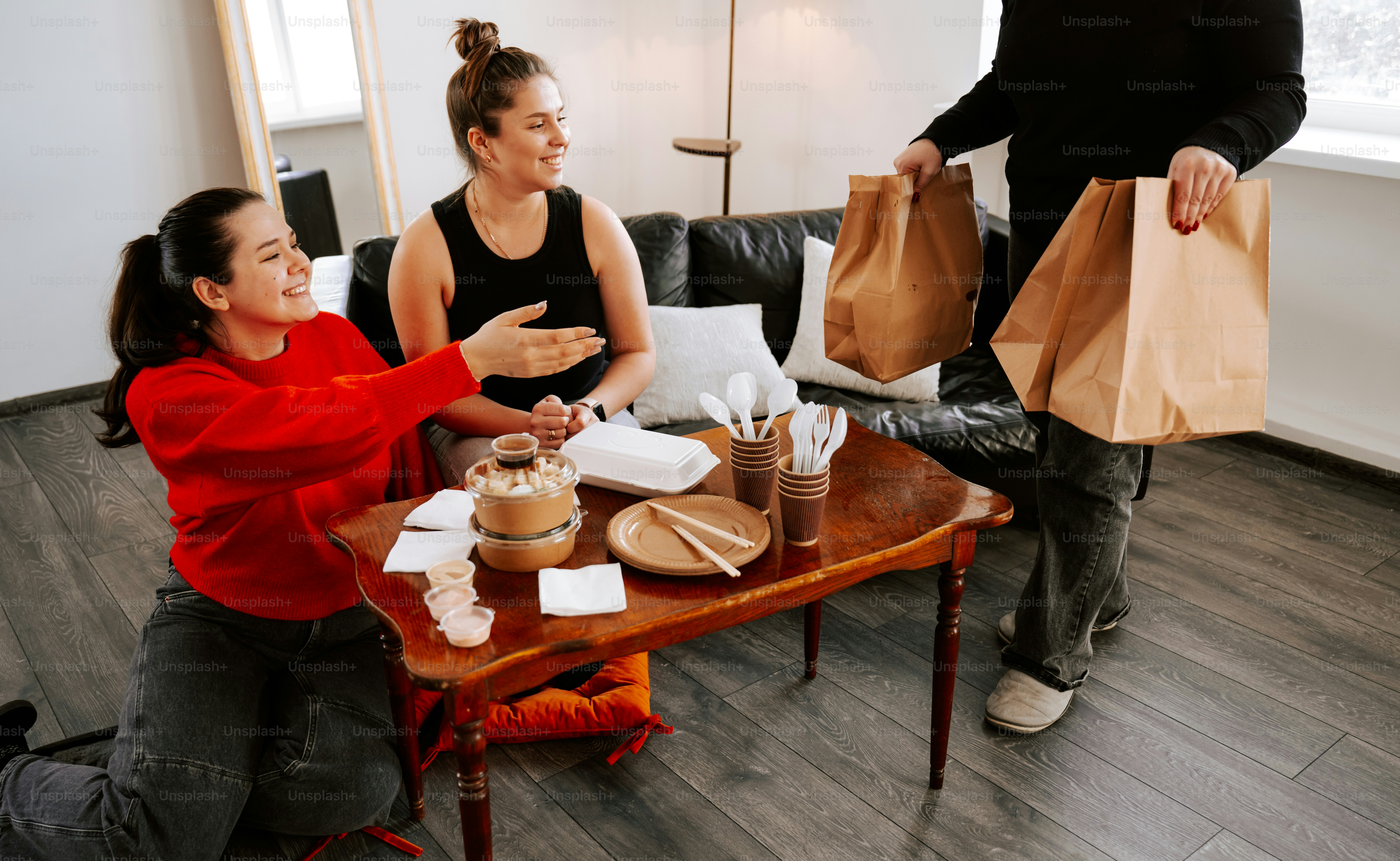 A group of people sitting around a wooden table