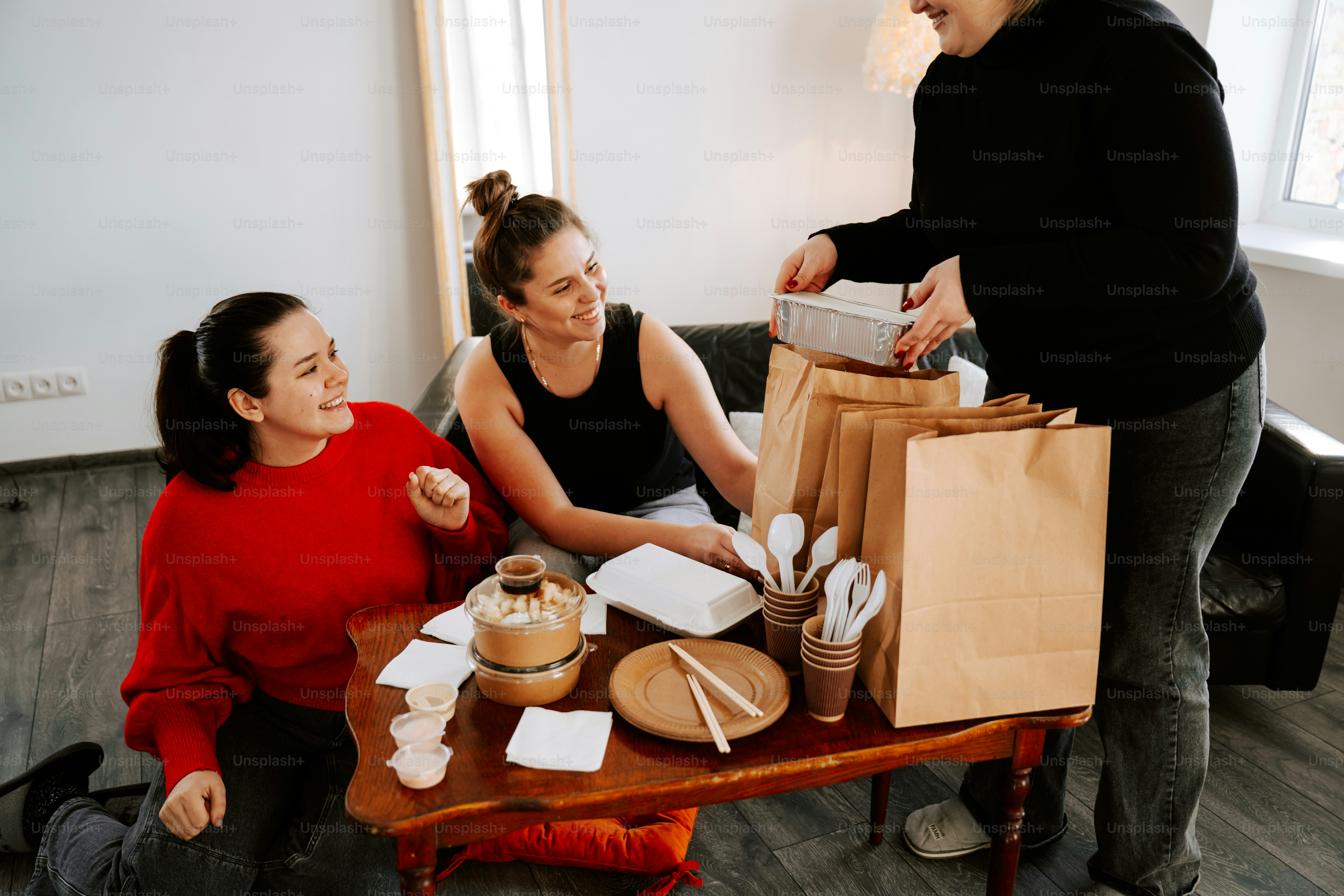 A man standing next to a woman sitting at a table
