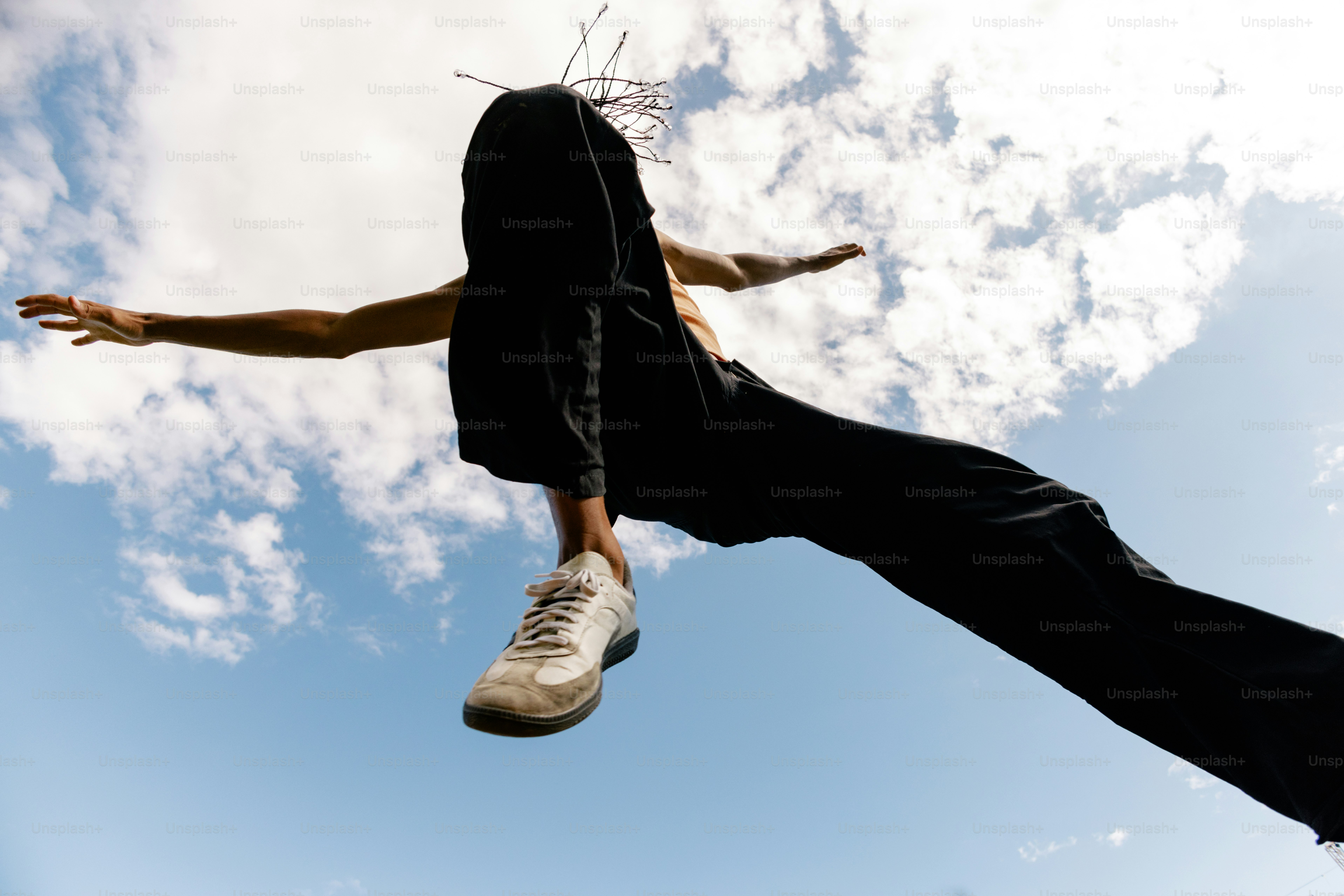 A man flying through the air while riding a skateboard