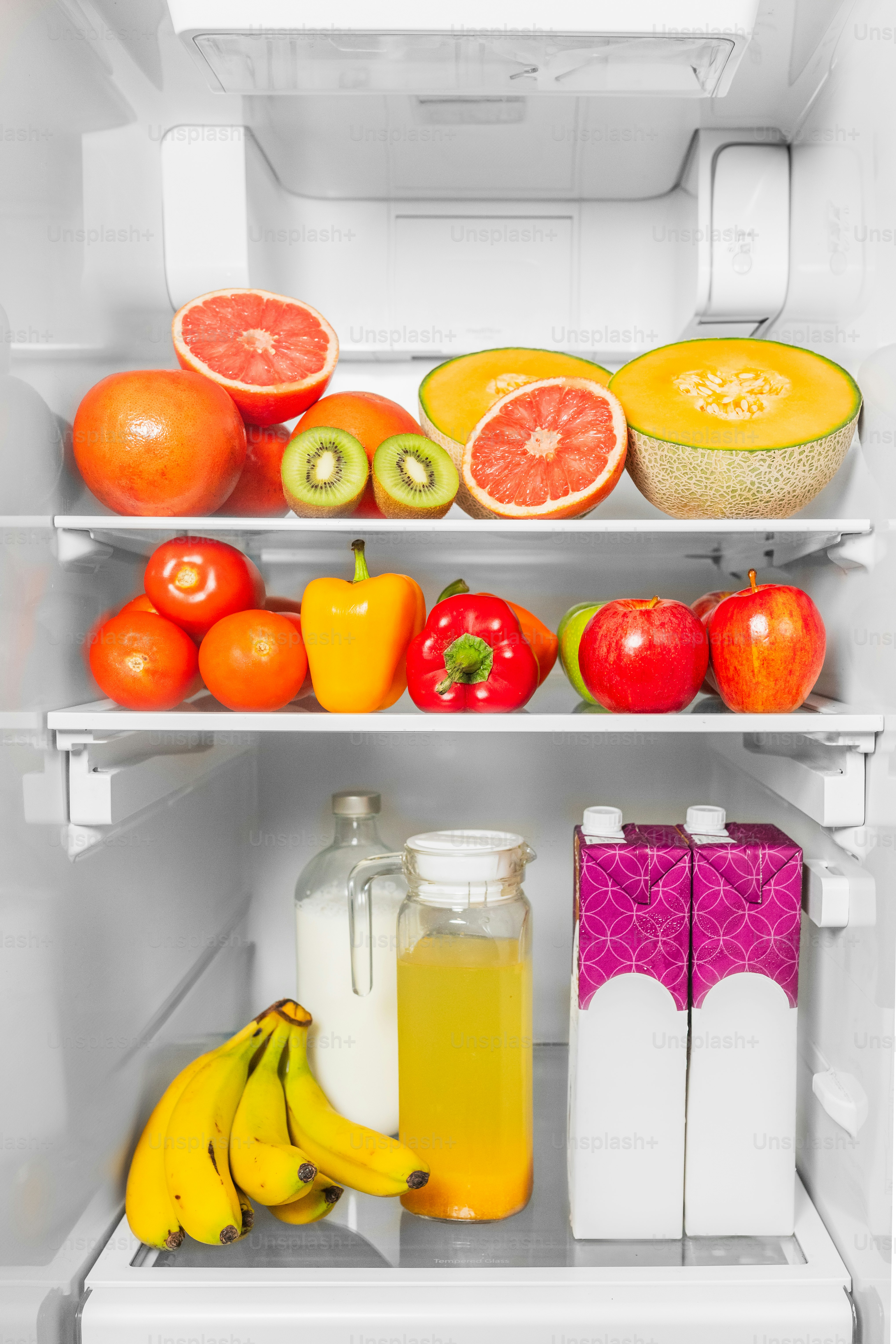 A refrigerator filled with lots of fresh fruits and vegetables