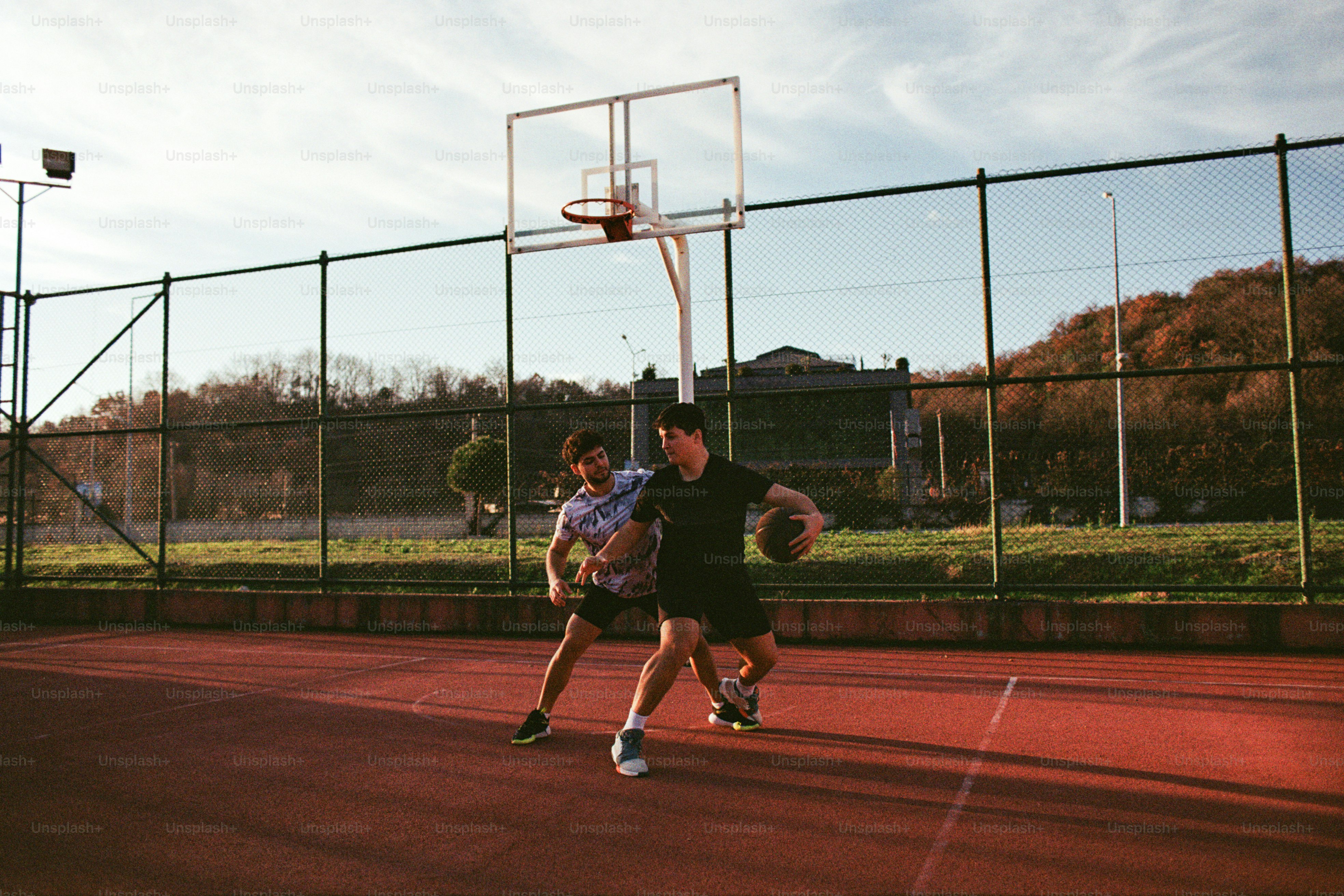 A group of young men playing a game of basketball