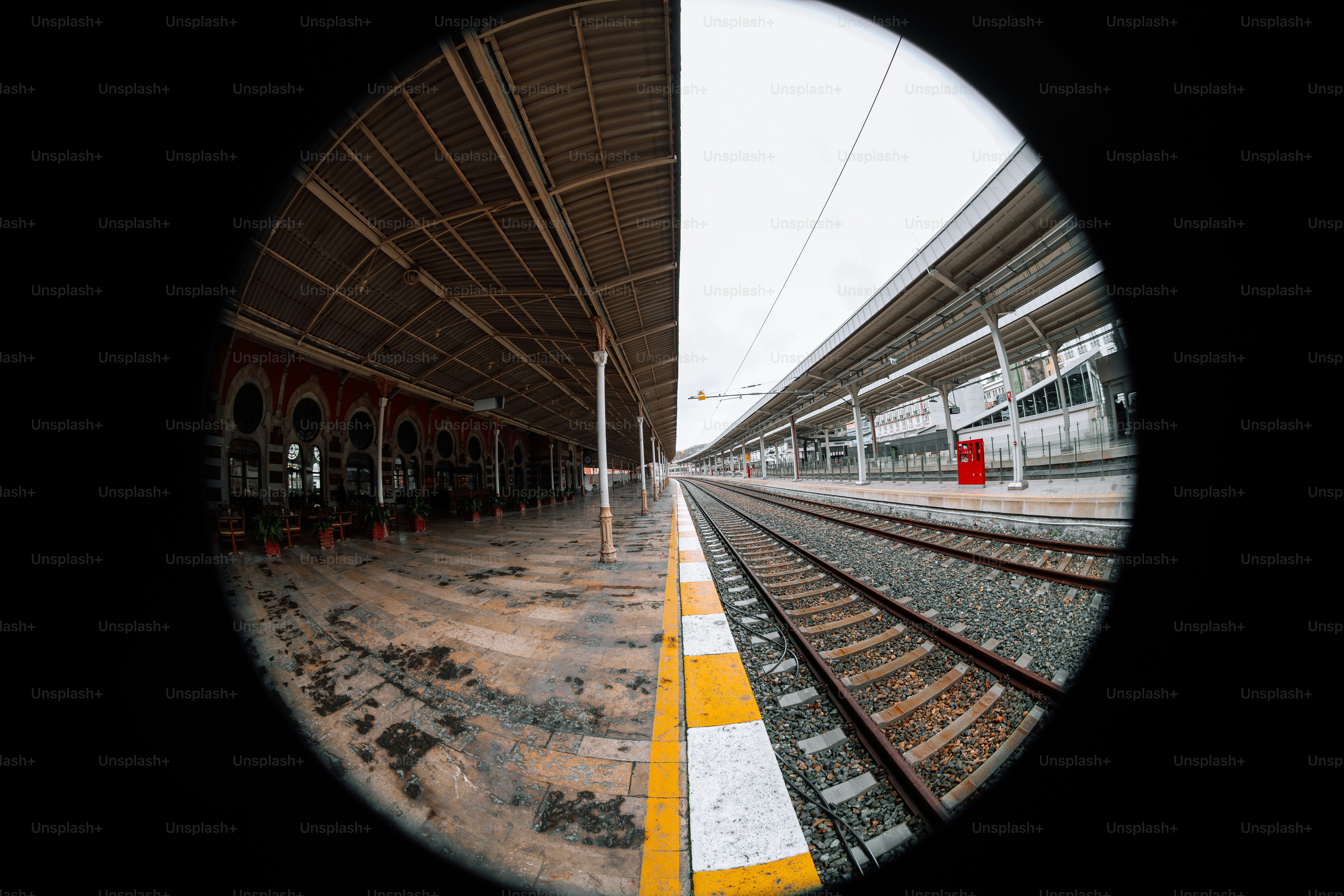 A view of a train station through a round window